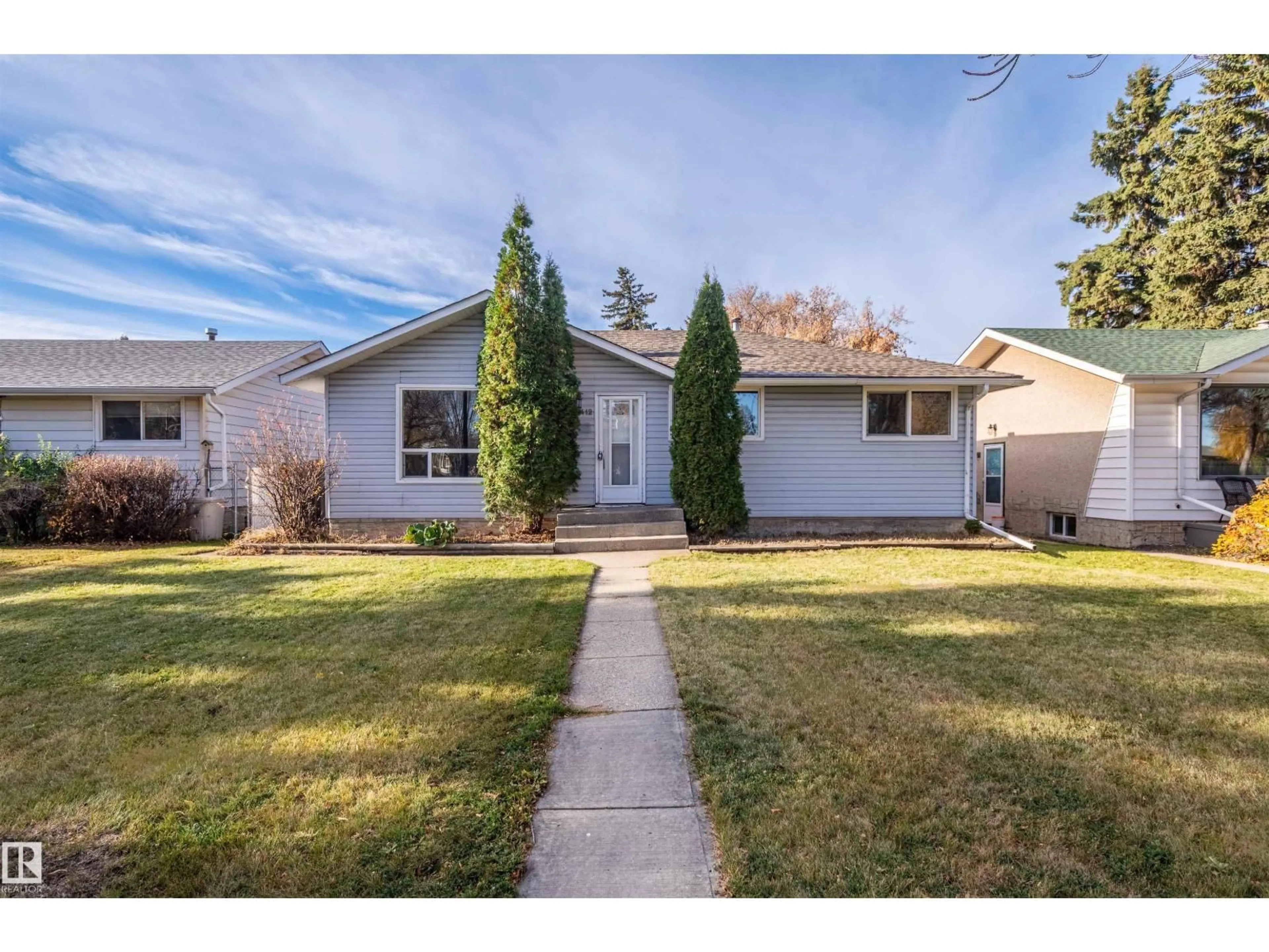 Home with vinyl exterior material, street for NW - 12412 134 ST, Edmonton Alberta T5L1V2
