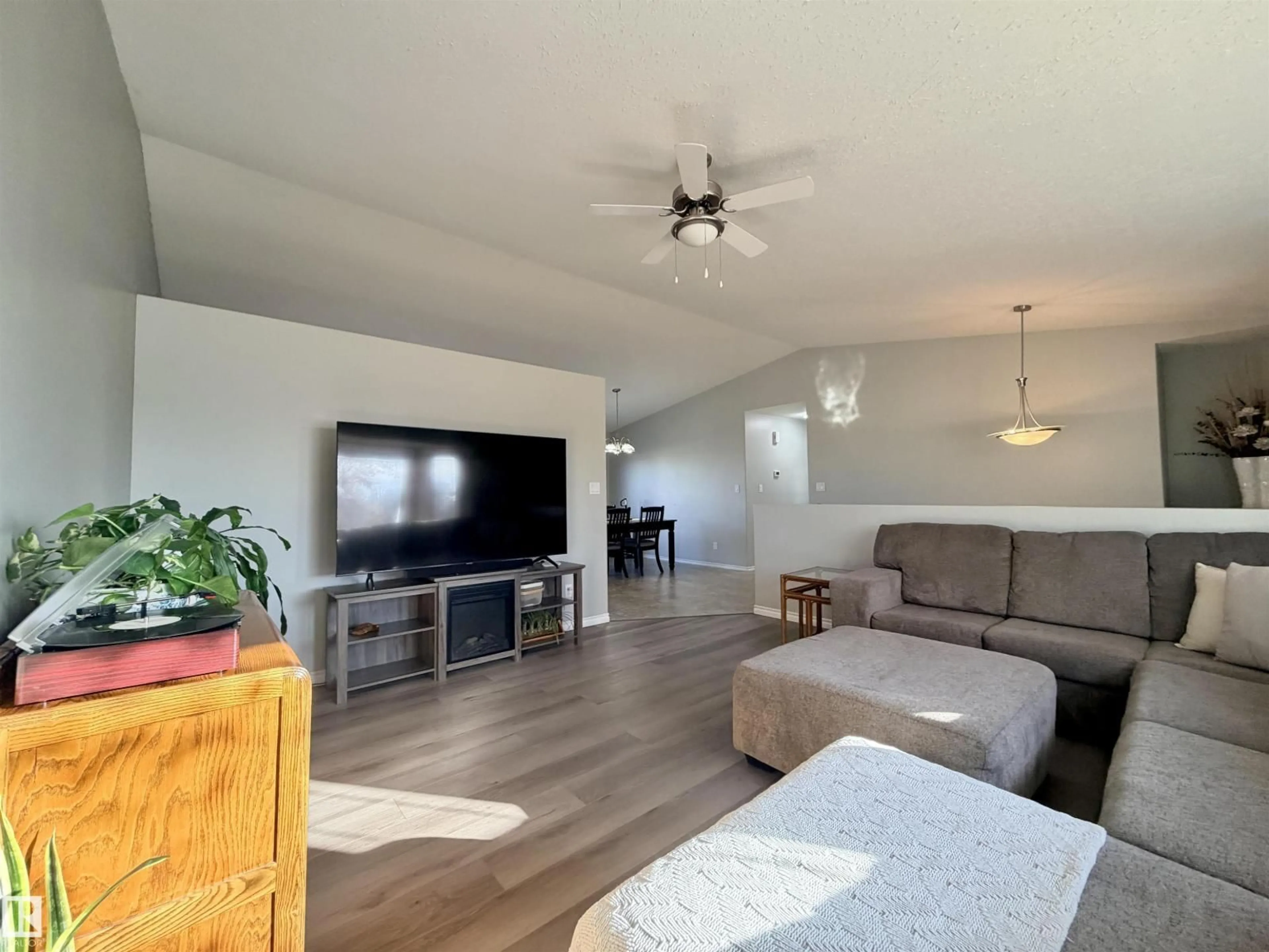 Living room with furniture, wood/laminate floor for 5734 47 AV, St. Paul Town Alberta T0A3A1