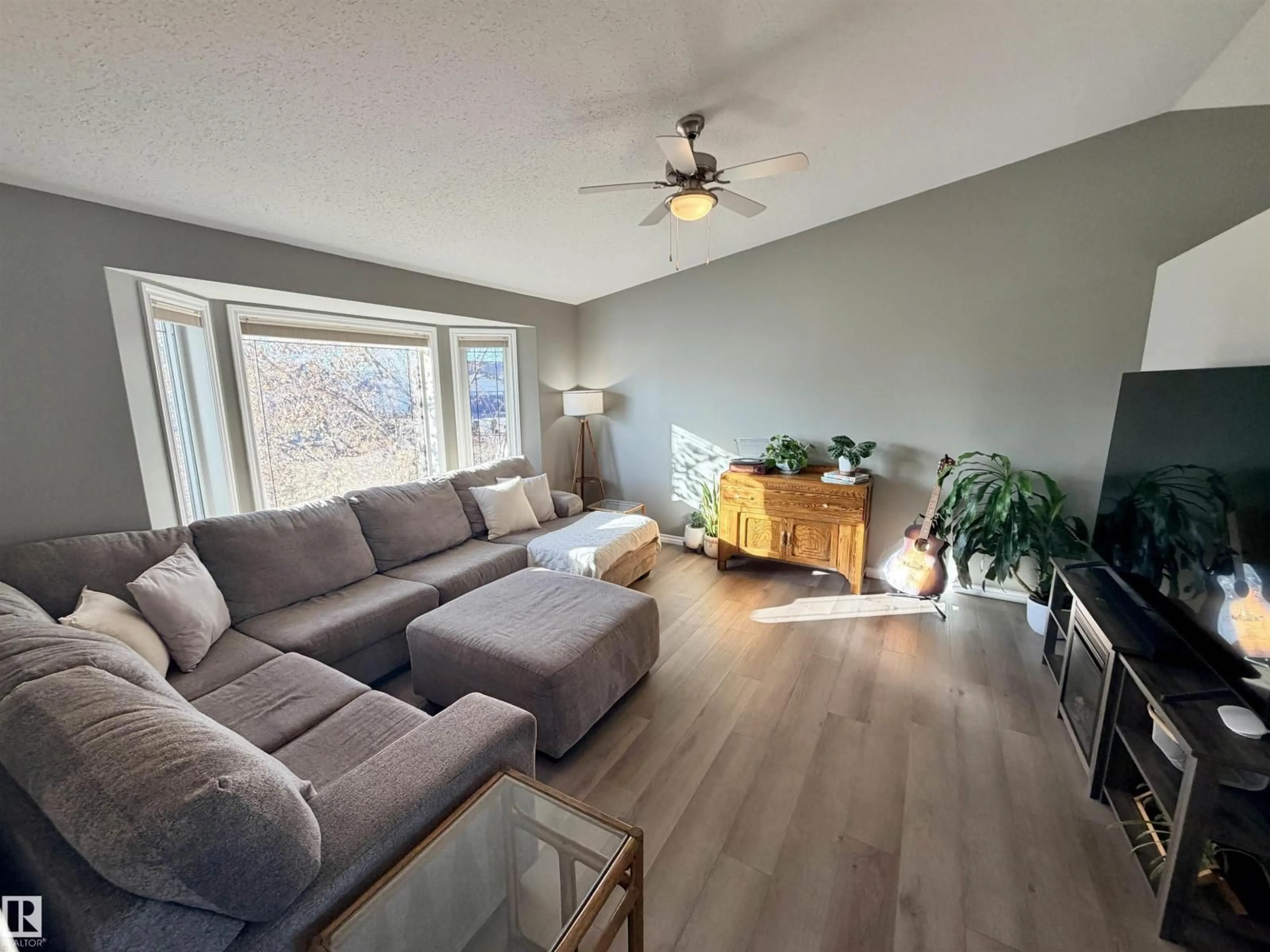 Living room with furniture, wood/laminate floor for 5734 47 AV, St. Paul Town Alberta T0A3A1