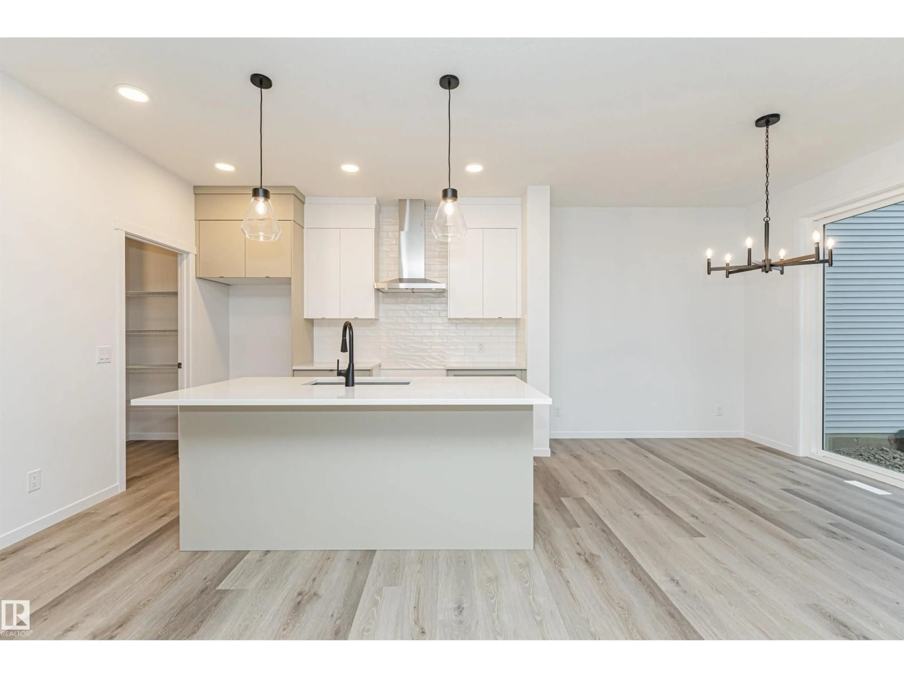 Open concept kitchen, wood/laminate floor for SW - 2340 160 ST, Edmonton Alberta T6W5X2