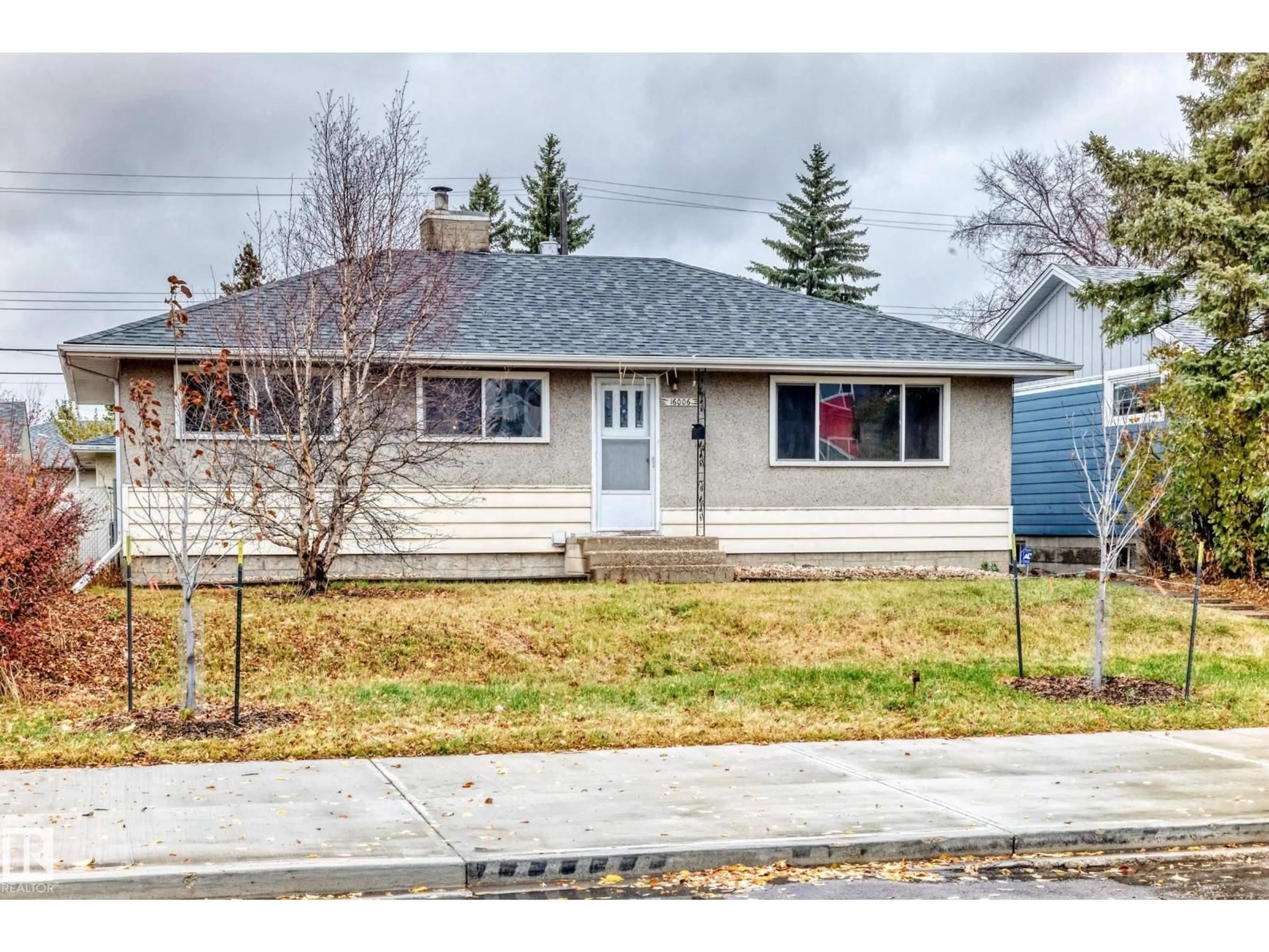 Home with vinyl exterior material, street for NW - 16006 87 AV, Edmonton Alberta T5R4G9