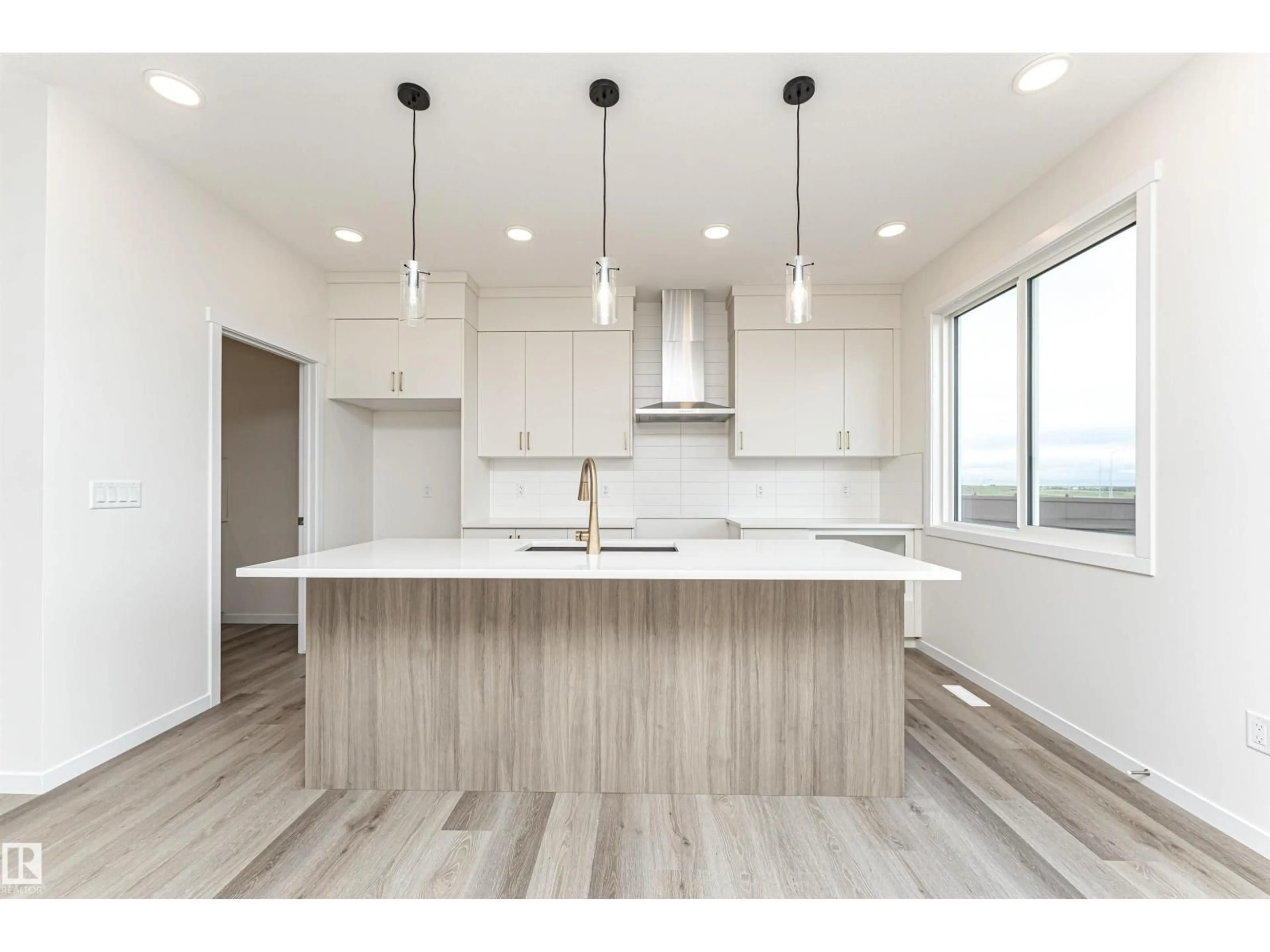 Open concept kitchen, wood/laminate floor for 6276 180 AV, Edmonton Alberta T5Y4L8