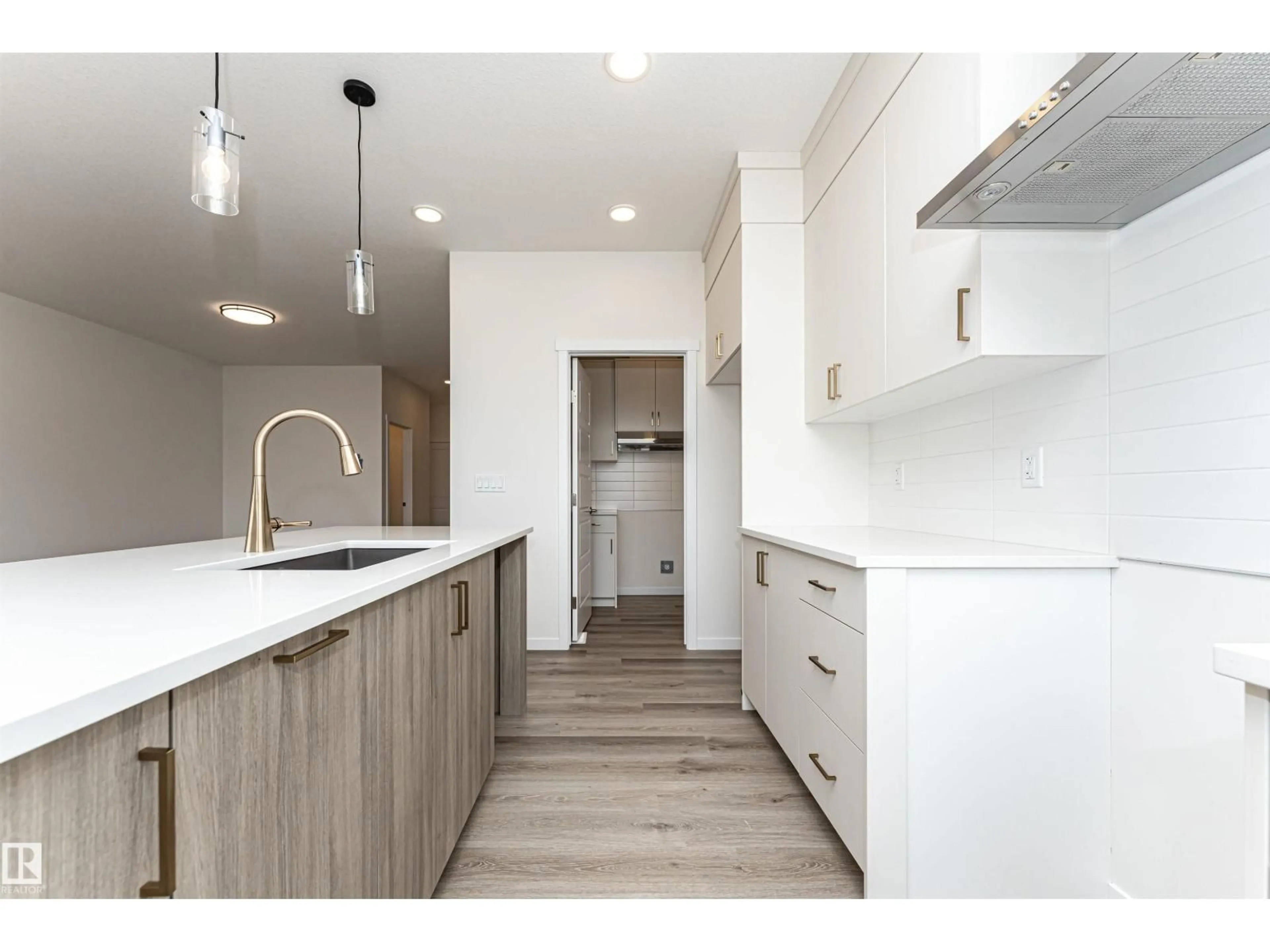 Open concept kitchen, wood/laminate floor for 6276 180 AV, Edmonton Alberta T5Y4L8