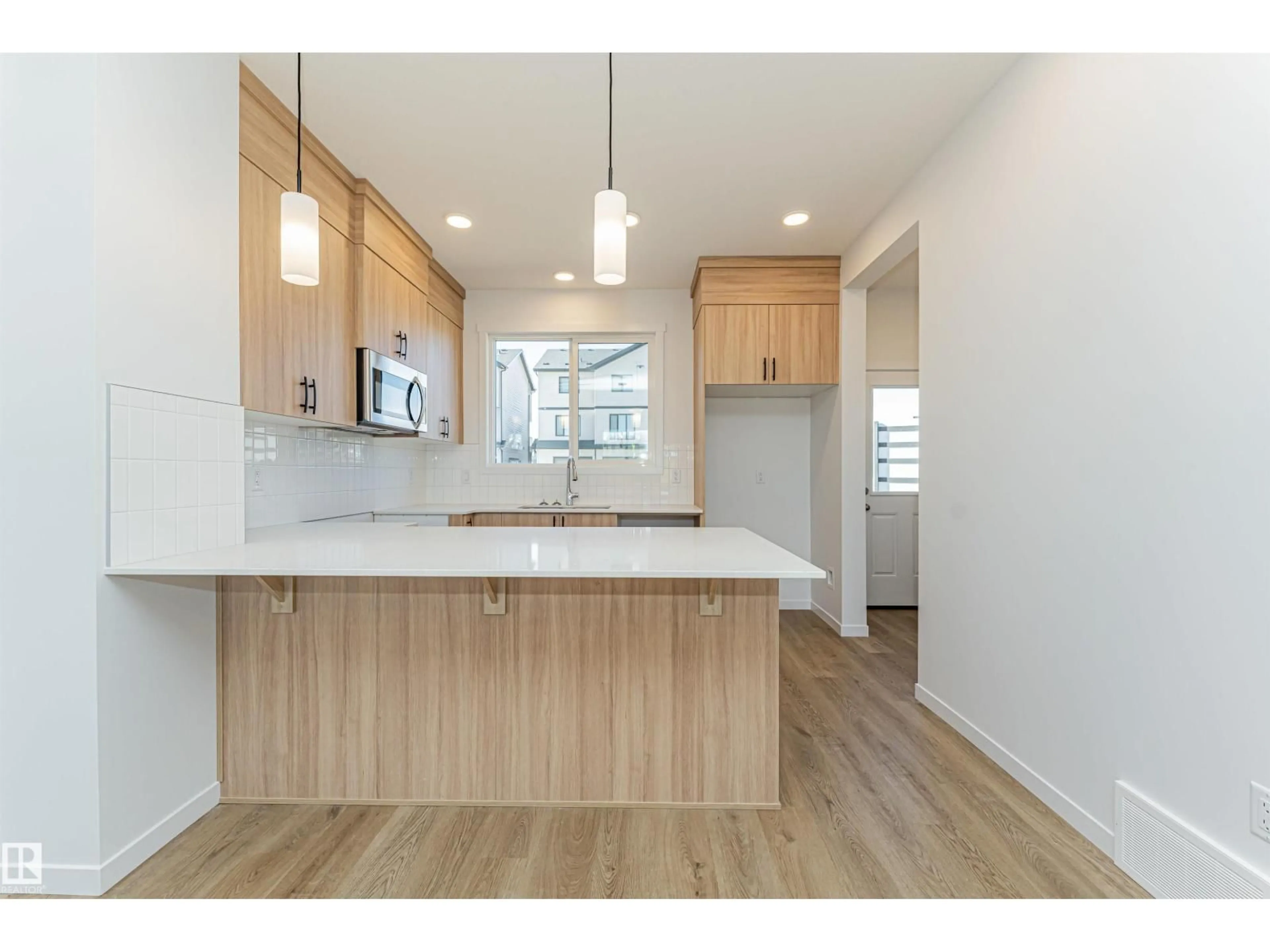 Open concept kitchen, wood/laminate floor for NW - 3896 WREN CR, Edmonton Alberta T5S0S9