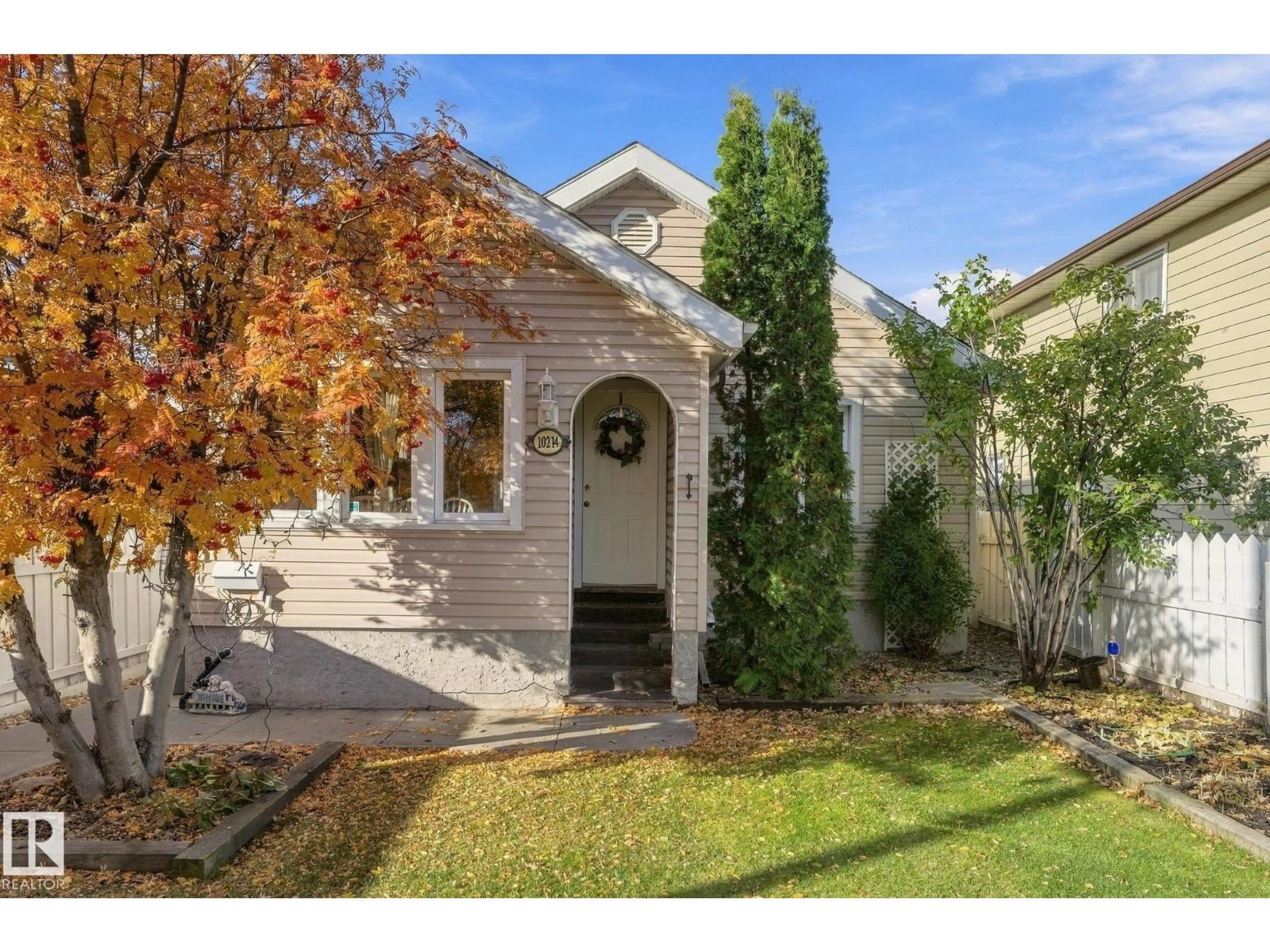 Home with vinyl exterior material, street for 10214 147 ST, Edmonton Alberta T5N3B9