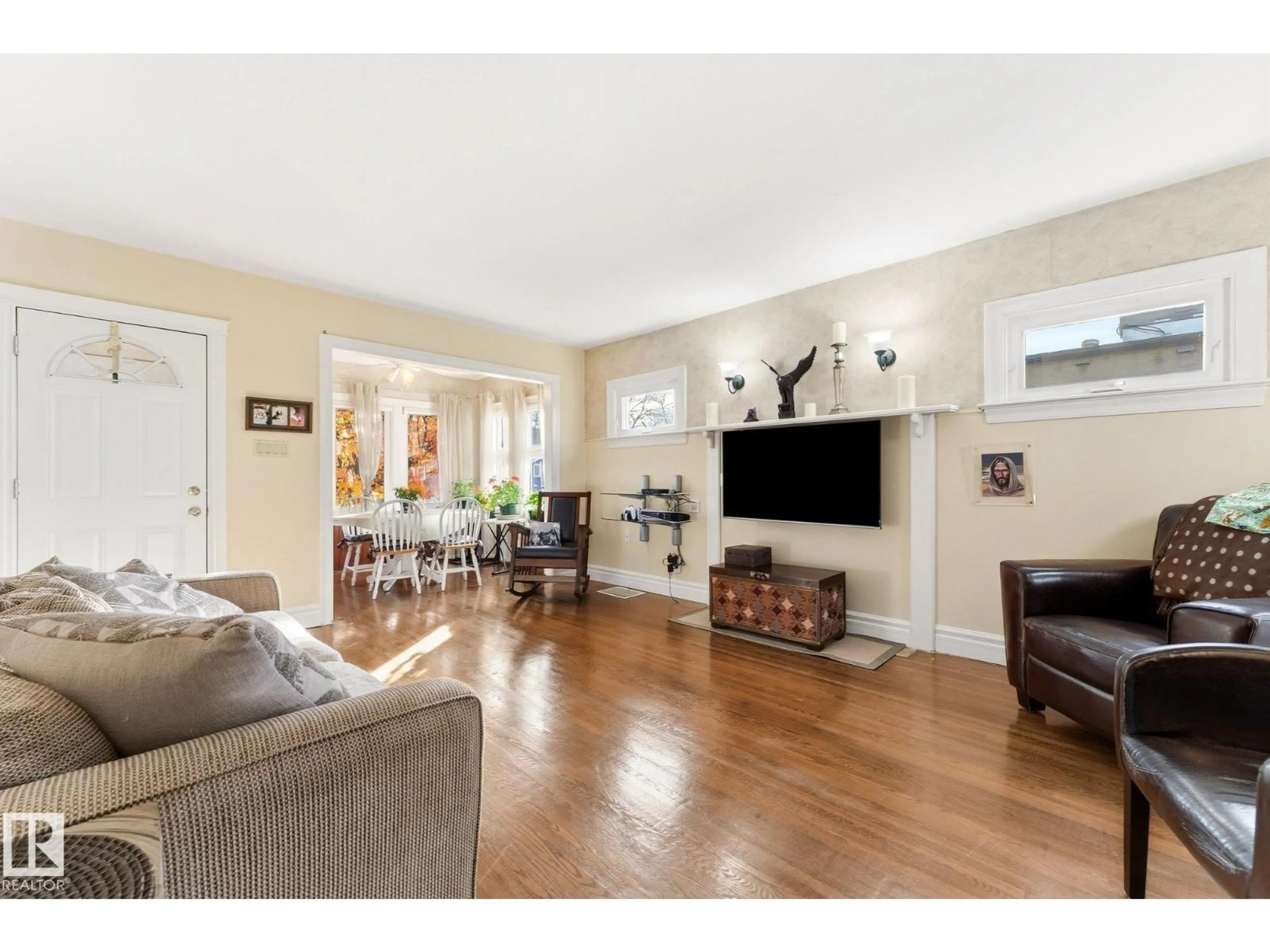 Living room with furniture, wood/laminate floor for 10214 147 ST, Edmonton Alberta T5N3B9