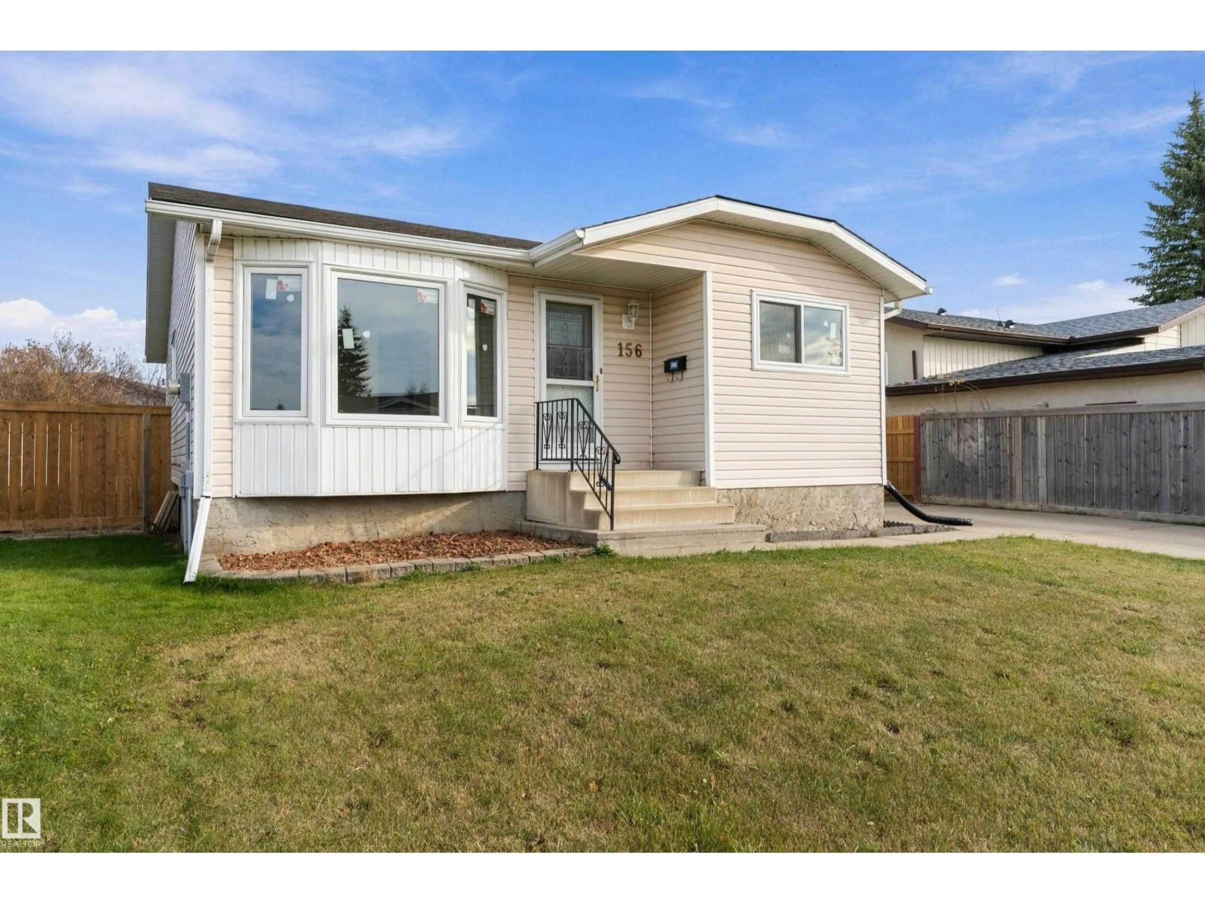 Home with vinyl exterior material, street for 156 DUNLUCE RD, Edmonton Alberta T5X4N9