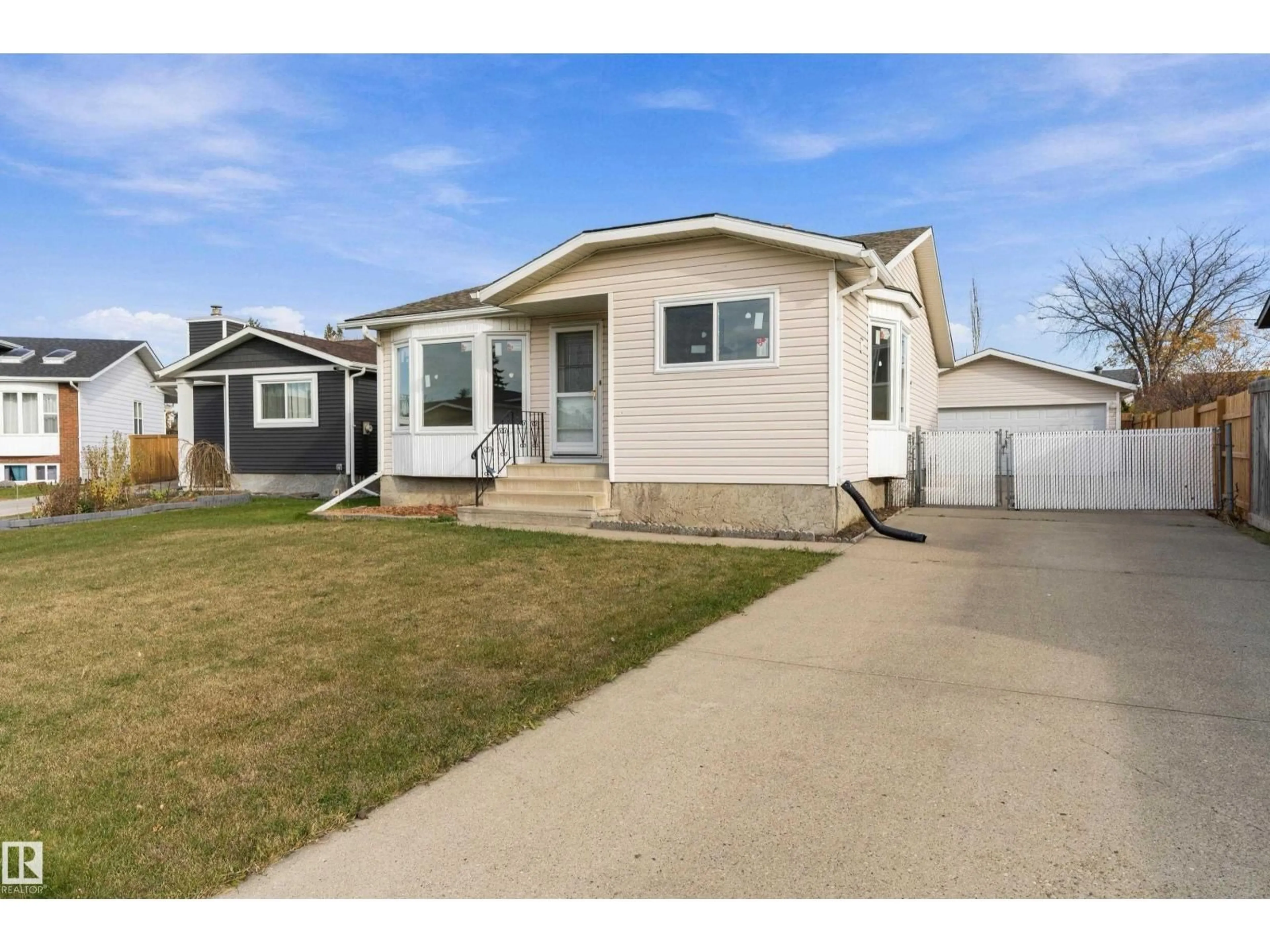 Home with vinyl exterior material, street for 156 DUNLUCE RD, Edmonton Alberta T5X4N9