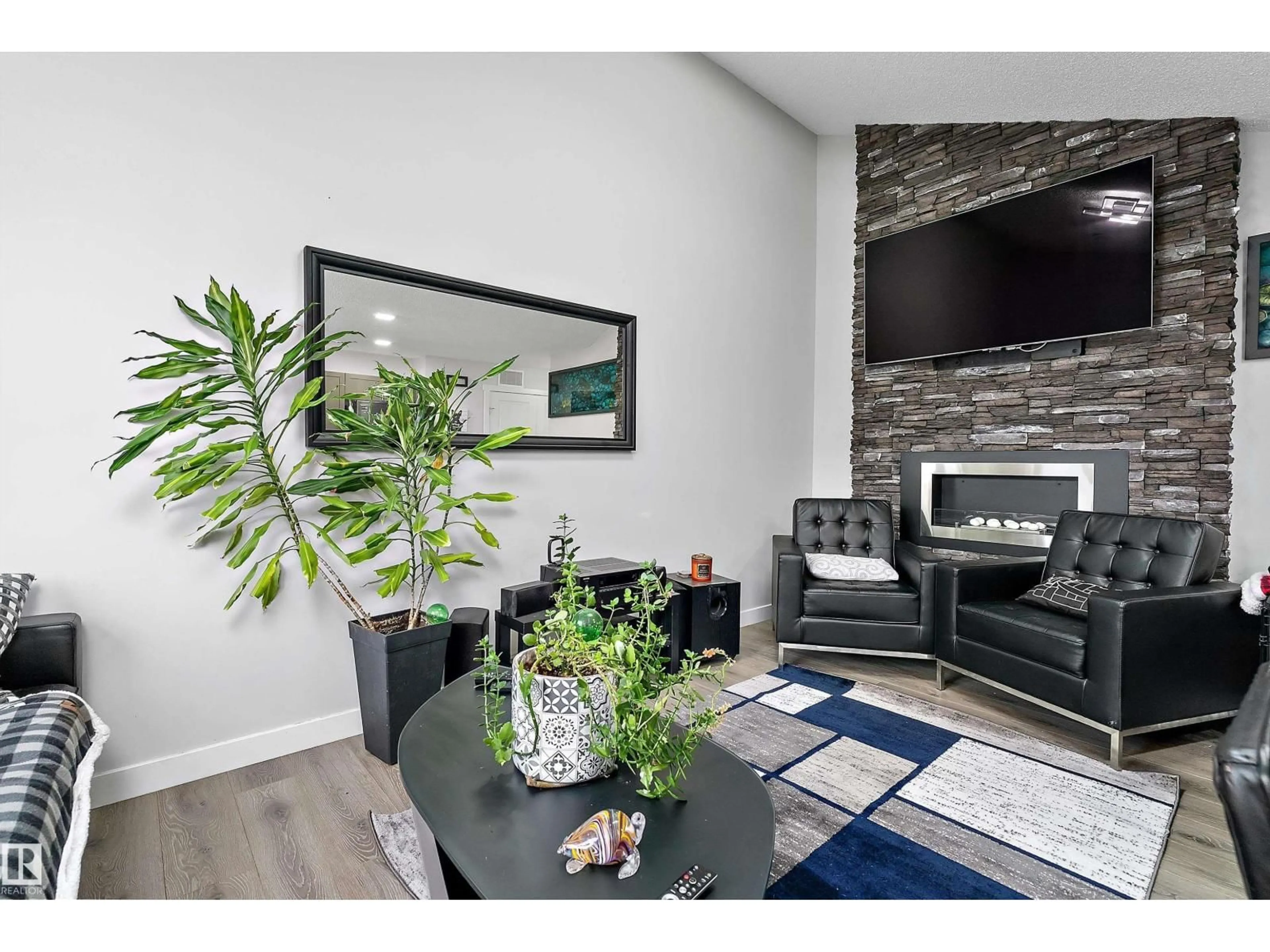 Living room with furniture, unknown for 69 1203 163 ST SW, Edmonton Alberta T6W3X1