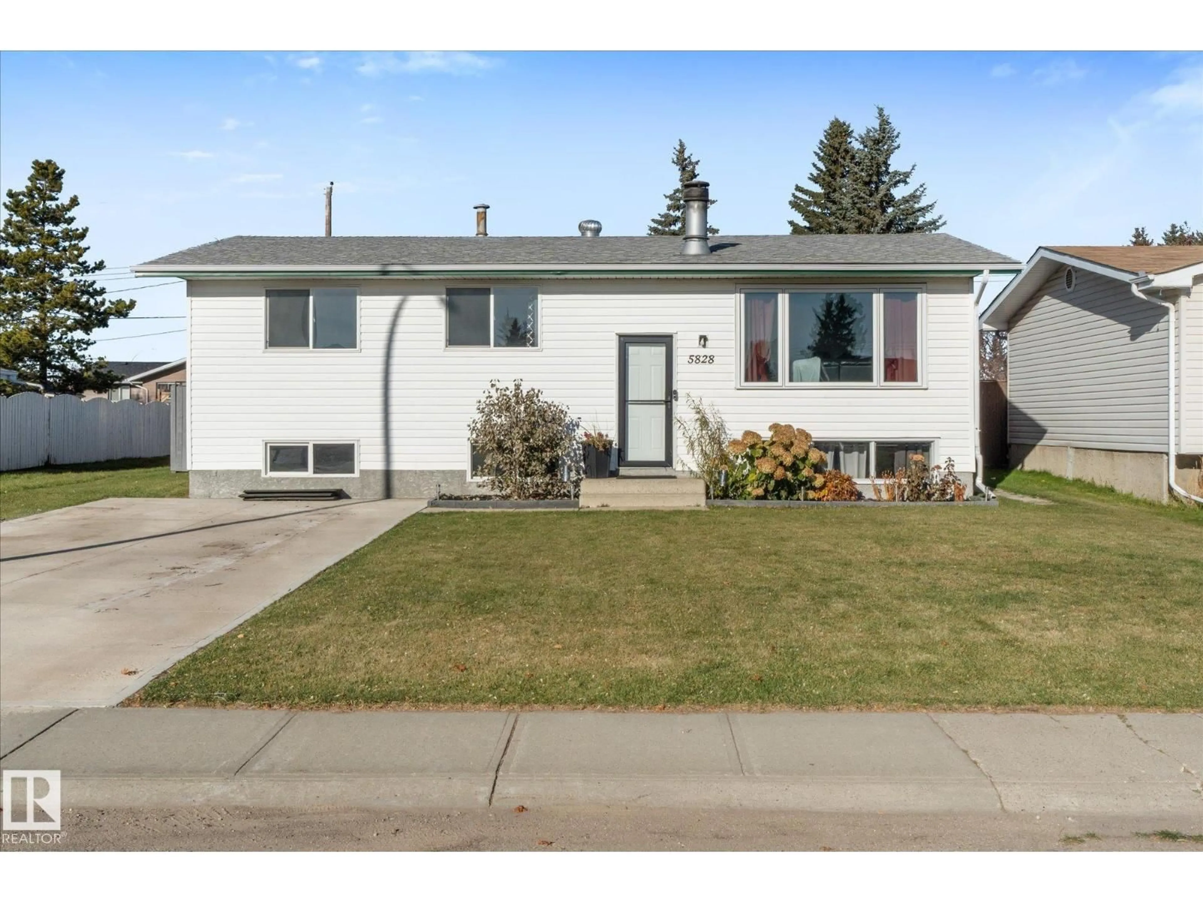 Home with vinyl exterior material, street for 5828 51 AV, Redwater Alberta T0A2W0