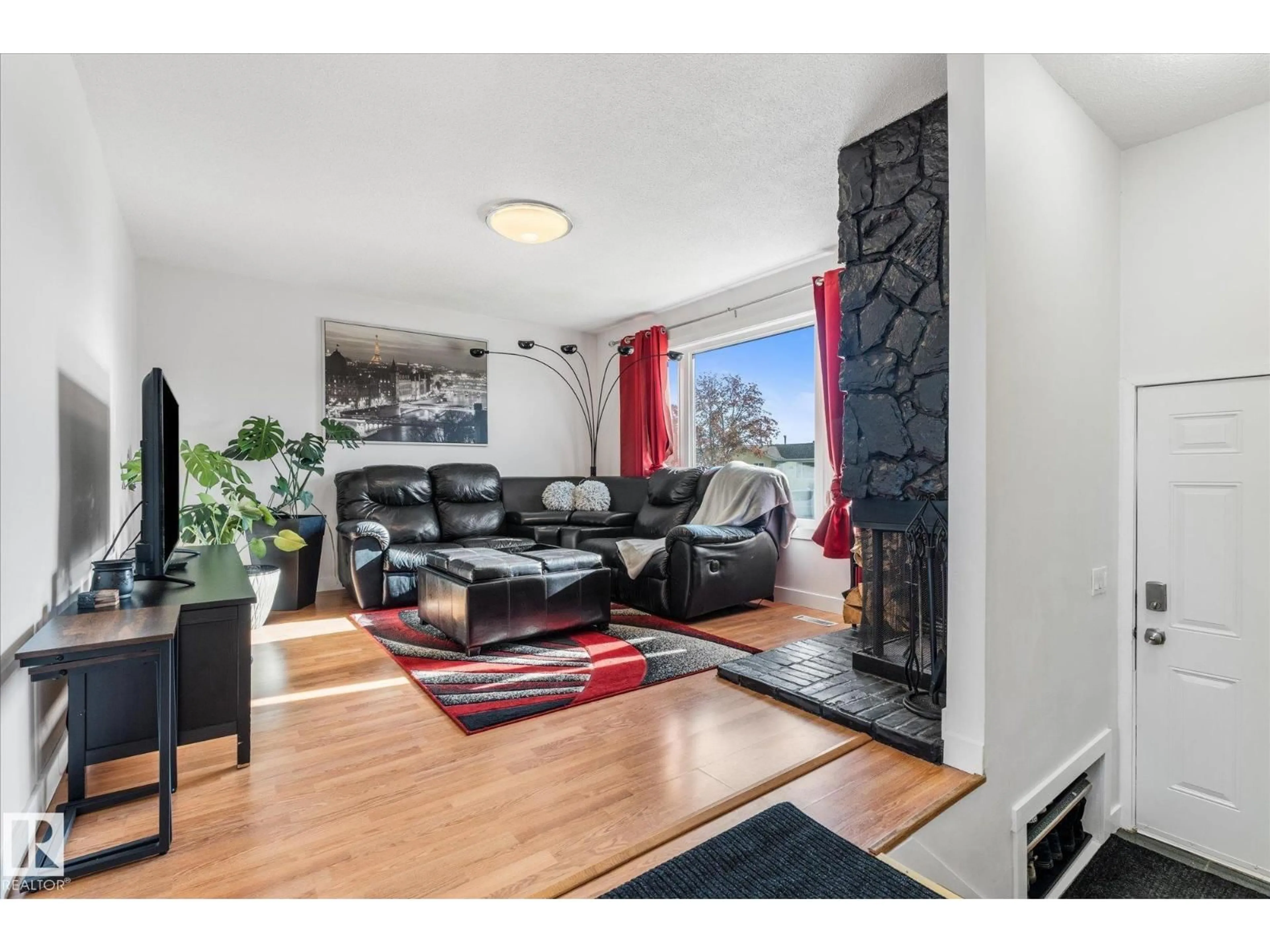 Living room with furniture, wood/laminate floor for 5828 51 AV, Redwater Alberta T0A2W0