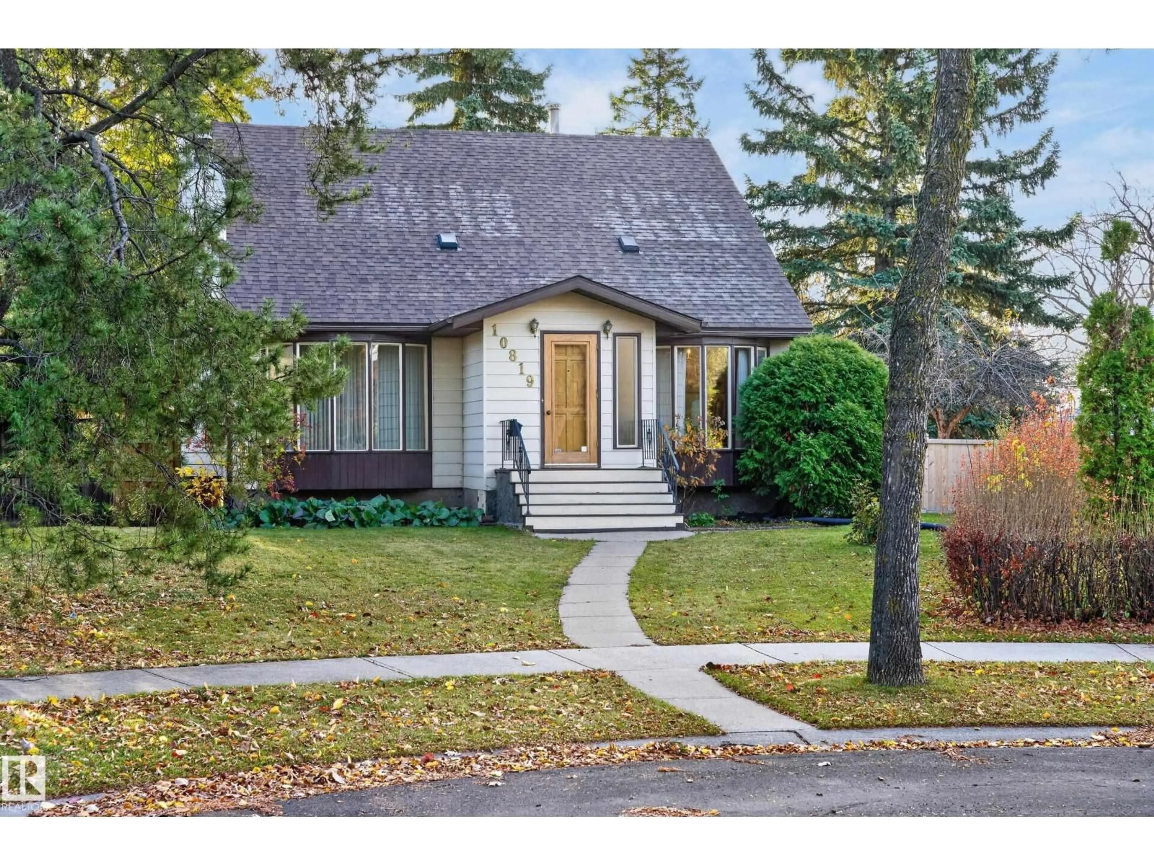 Home with vinyl exterior material, street for NW - 10819 131 ST, Edmonton Alberta T5M1B3