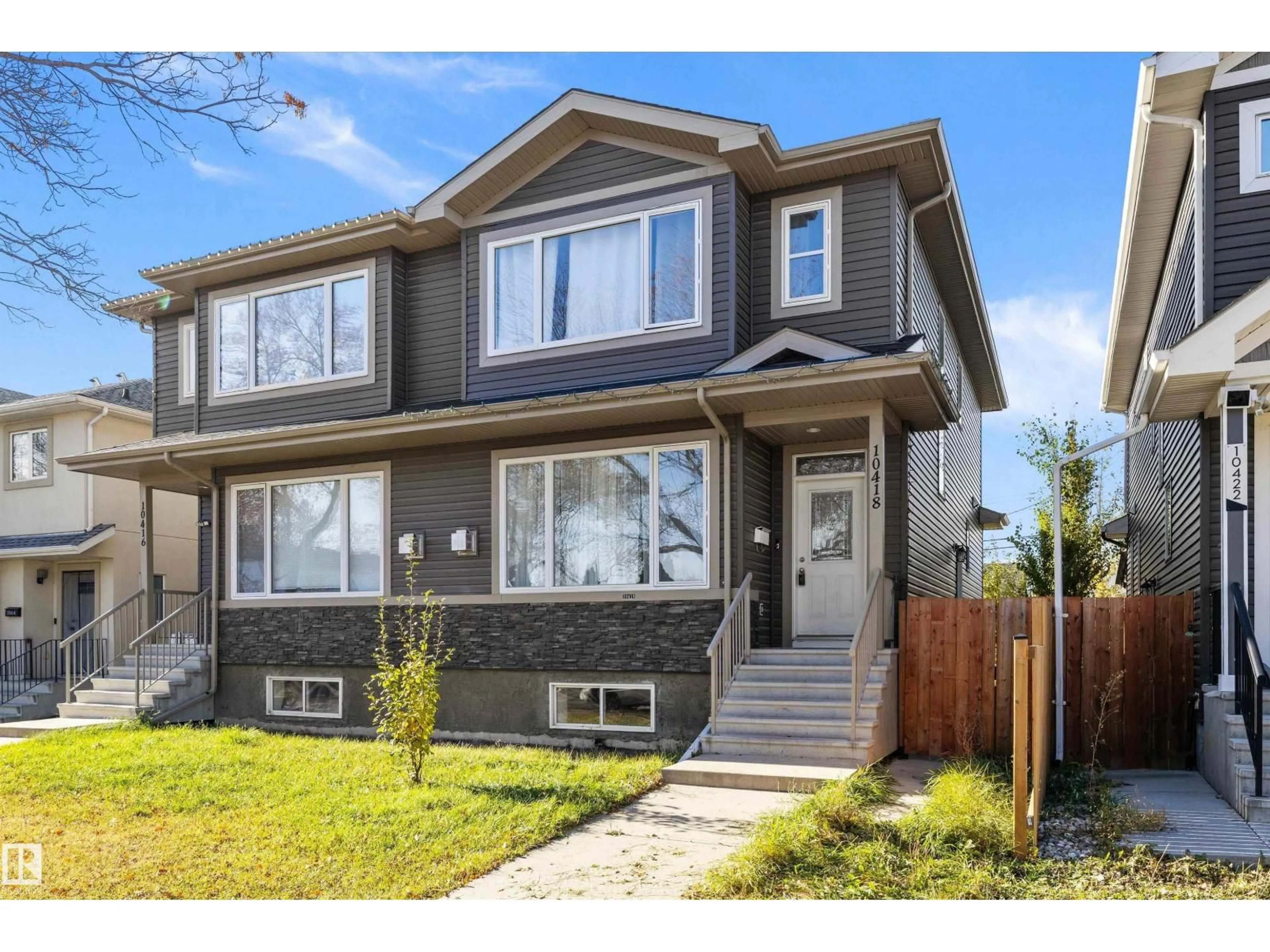 Home with vinyl exterior material, street for NW - 10418 155 ST, Edmonton Alberta T5P2M3