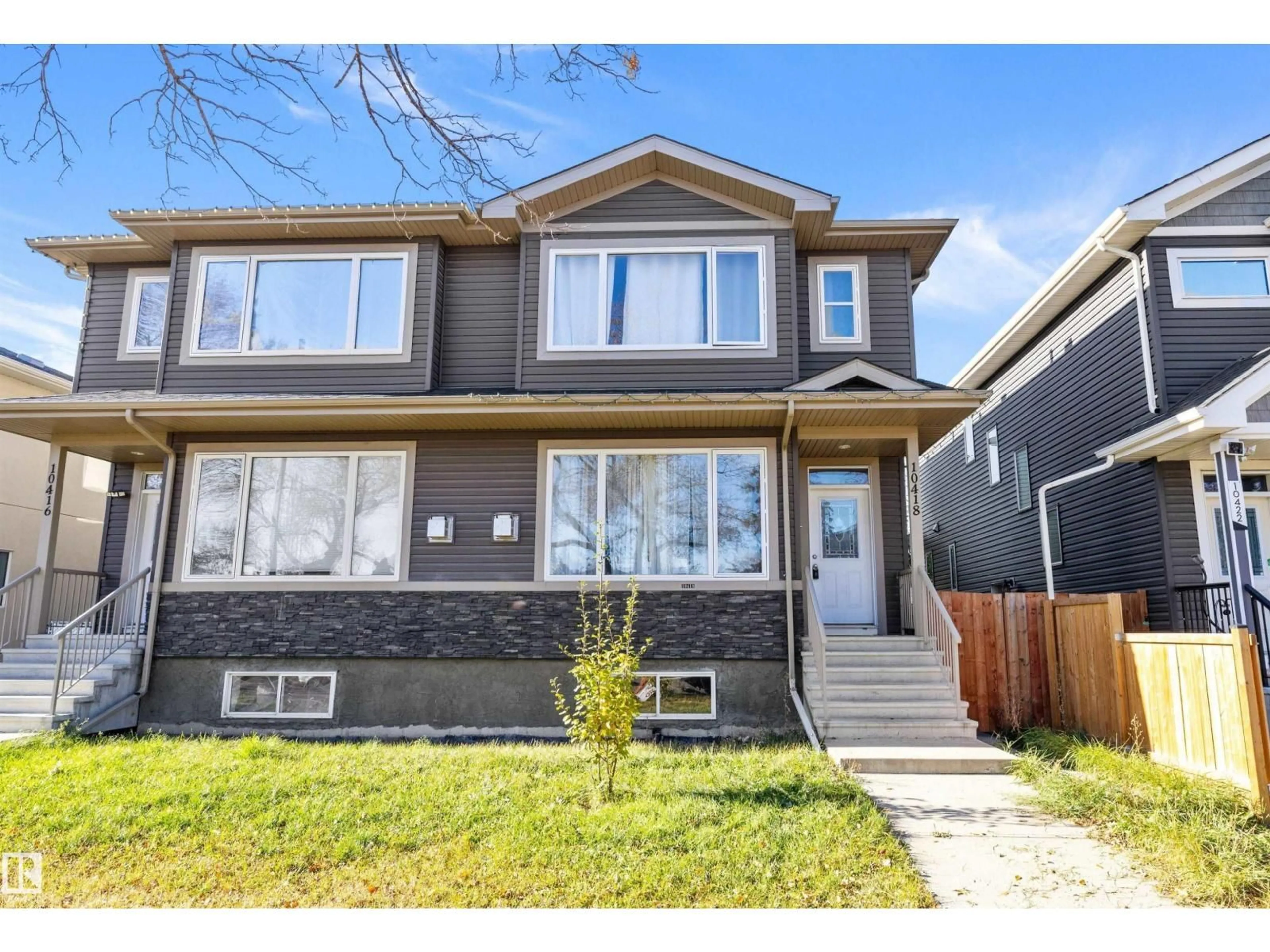 Home with vinyl exterior material, street for NW - 10418 155 ST, Edmonton Alberta T5P2M3
