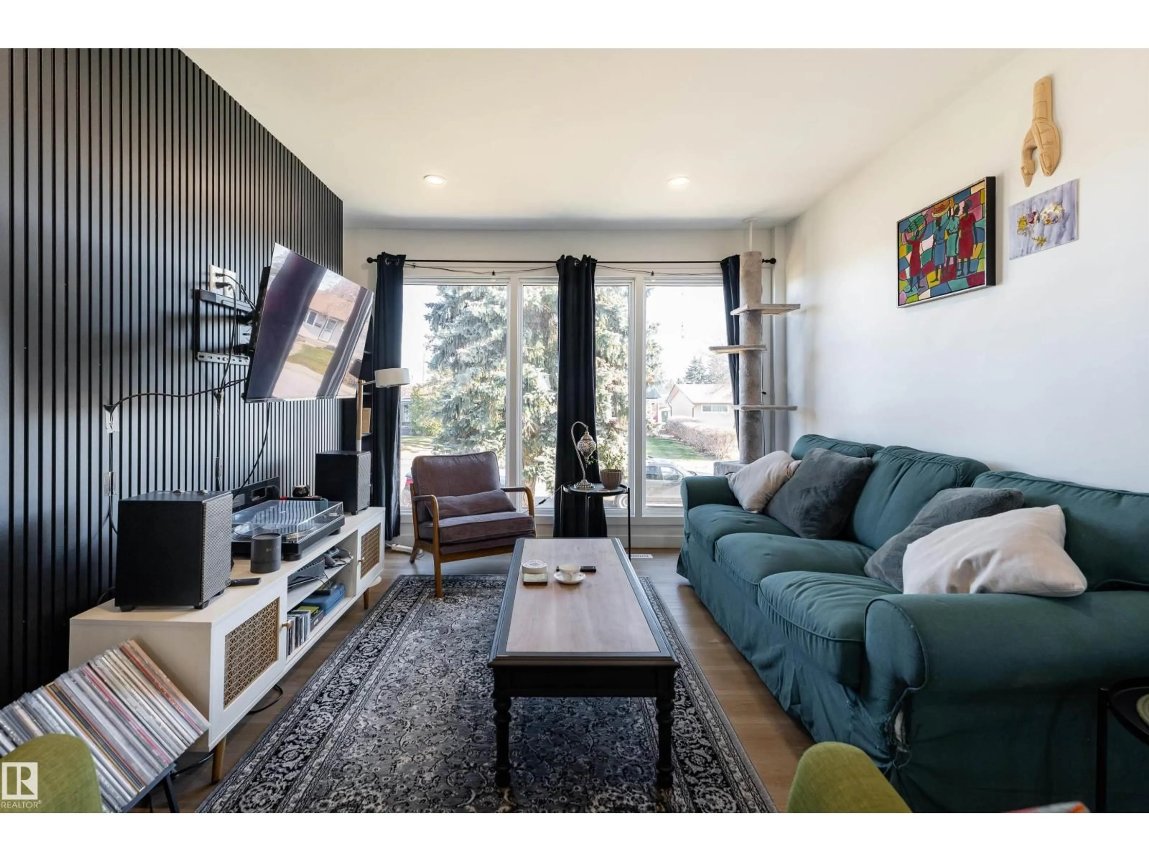 Living room with furniture, wood/laminate floor for NW - 13412 135 ST, Edmonton Alberta T5L1Y9