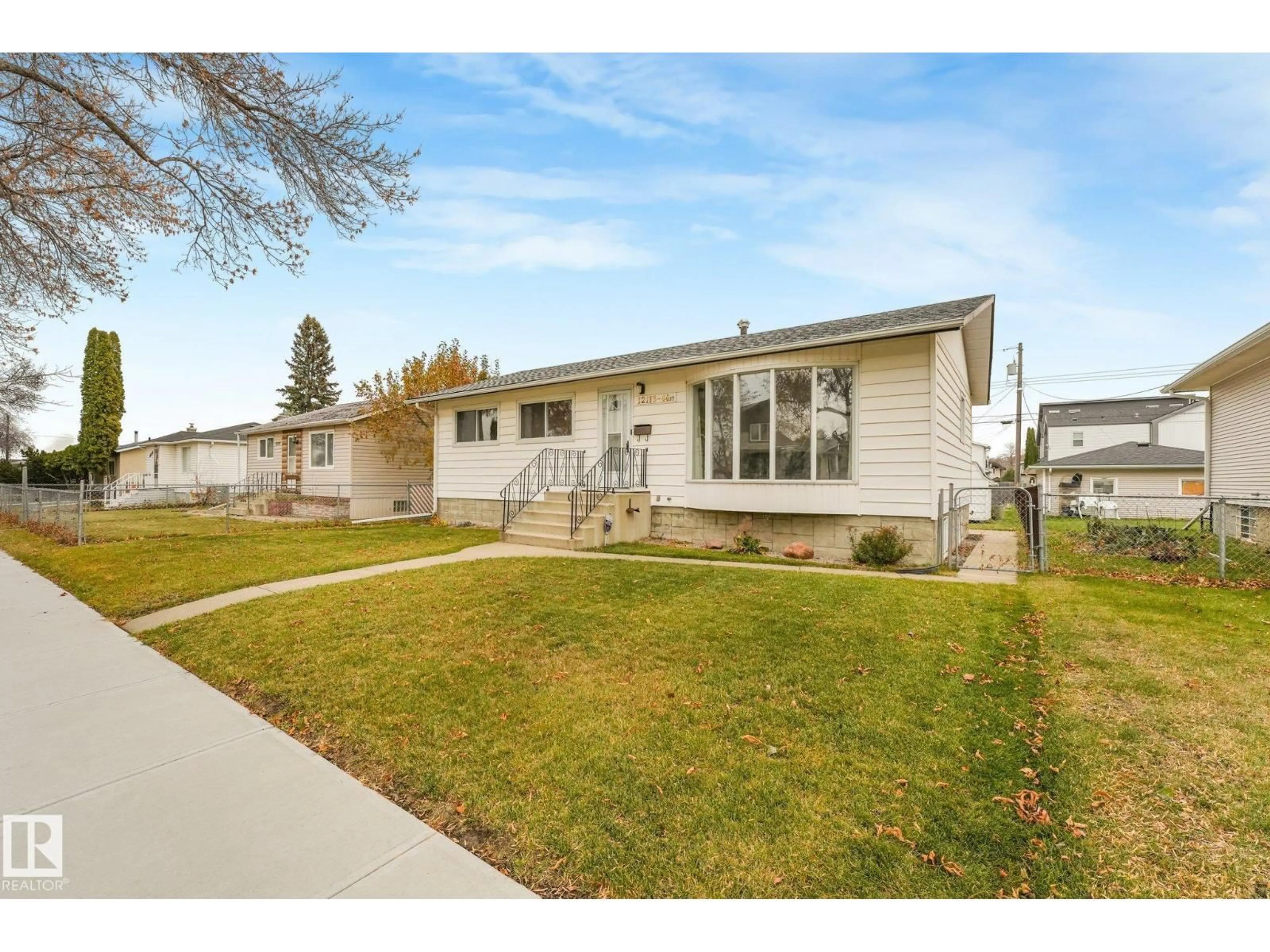 Home with vinyl exterior material, street for 12113 44 ST, Edmonton Alberta T5W2T2