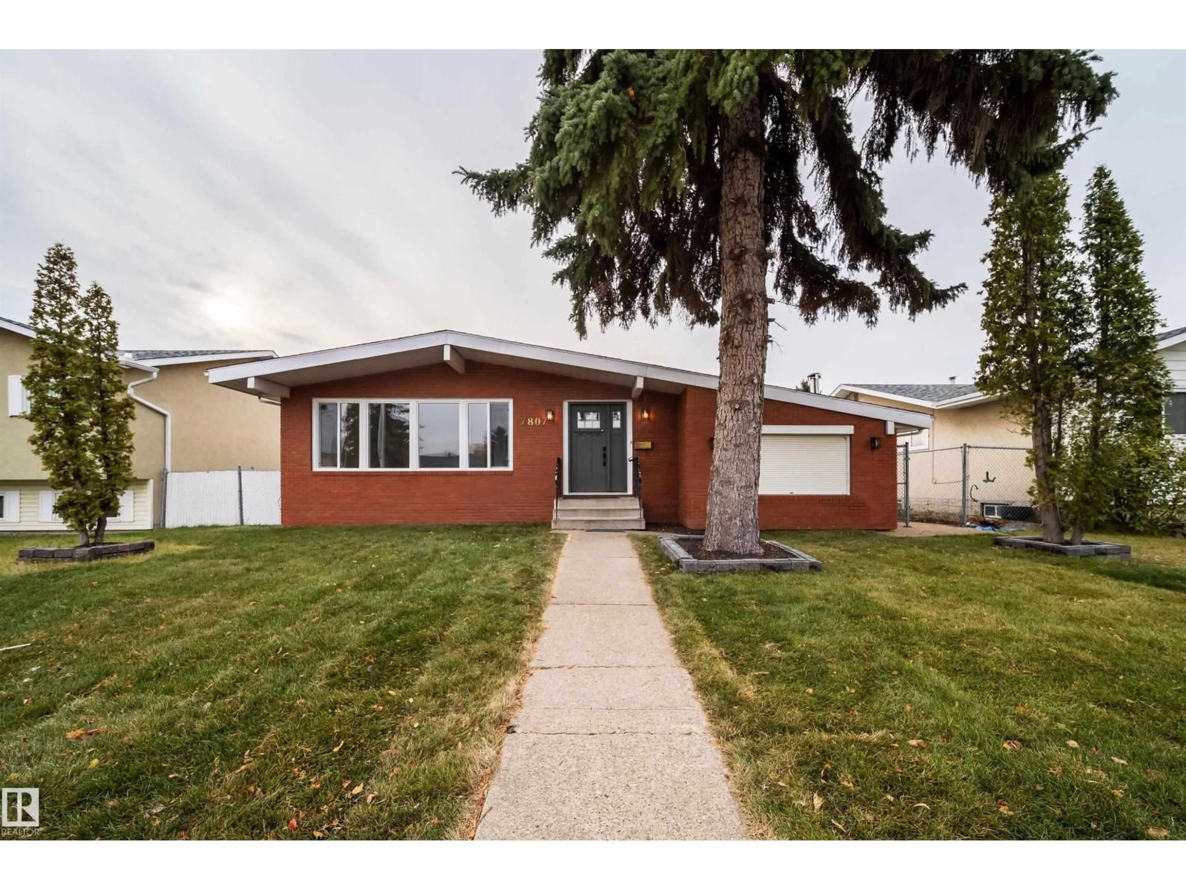 Home with vinyl exterior material, street for 7807 144 AV, Edmonton Alberta T5C2R9