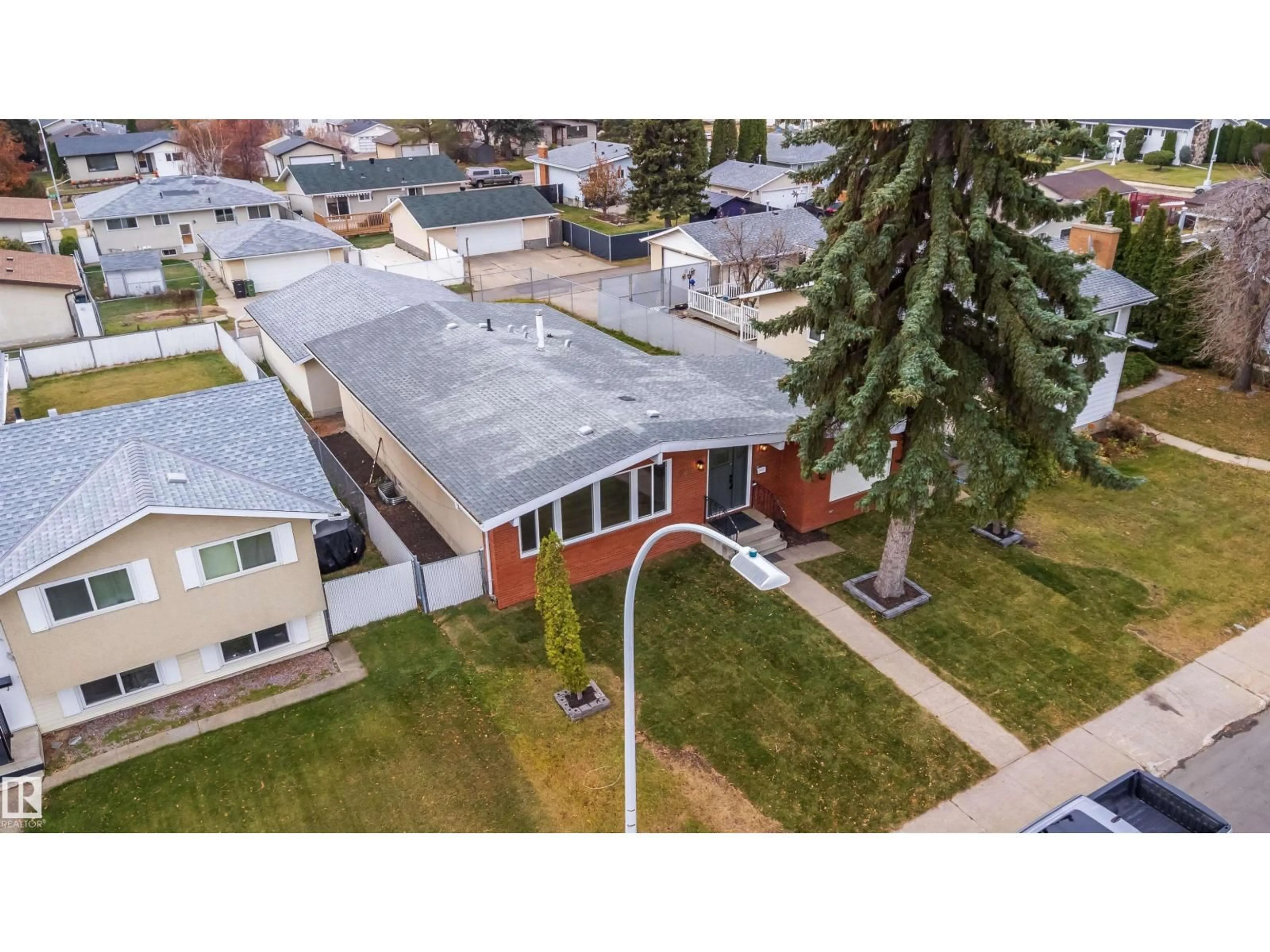 A pic from outside/outdoor area/front of a property/back of a property/a pic from drone, street for 7807 144 AV, Edmonton Alberta T5C2R9