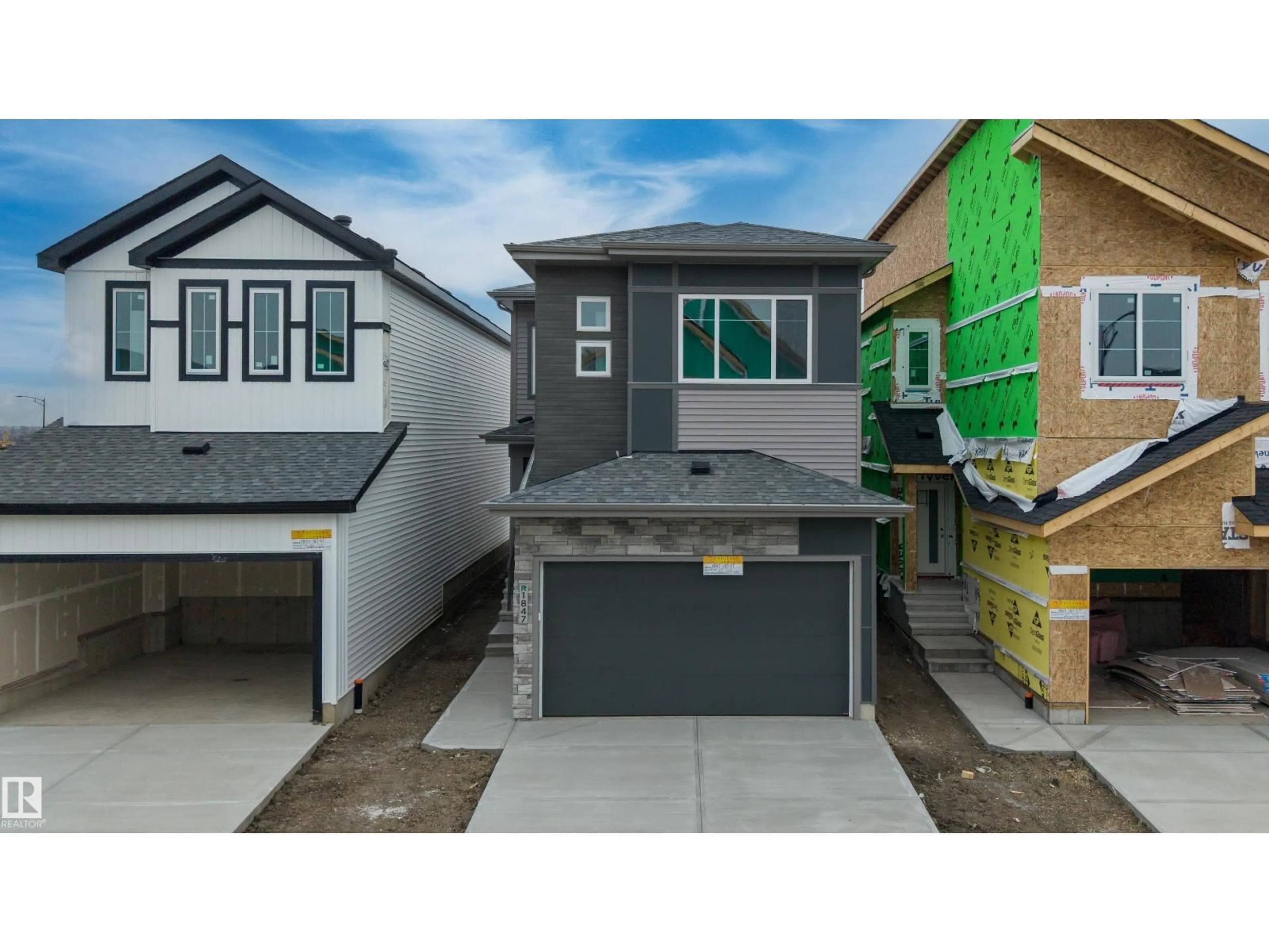 Home with vinyl exterior material, street for NW - 1847 187 ST, Edmonton Alberta T6M3N5