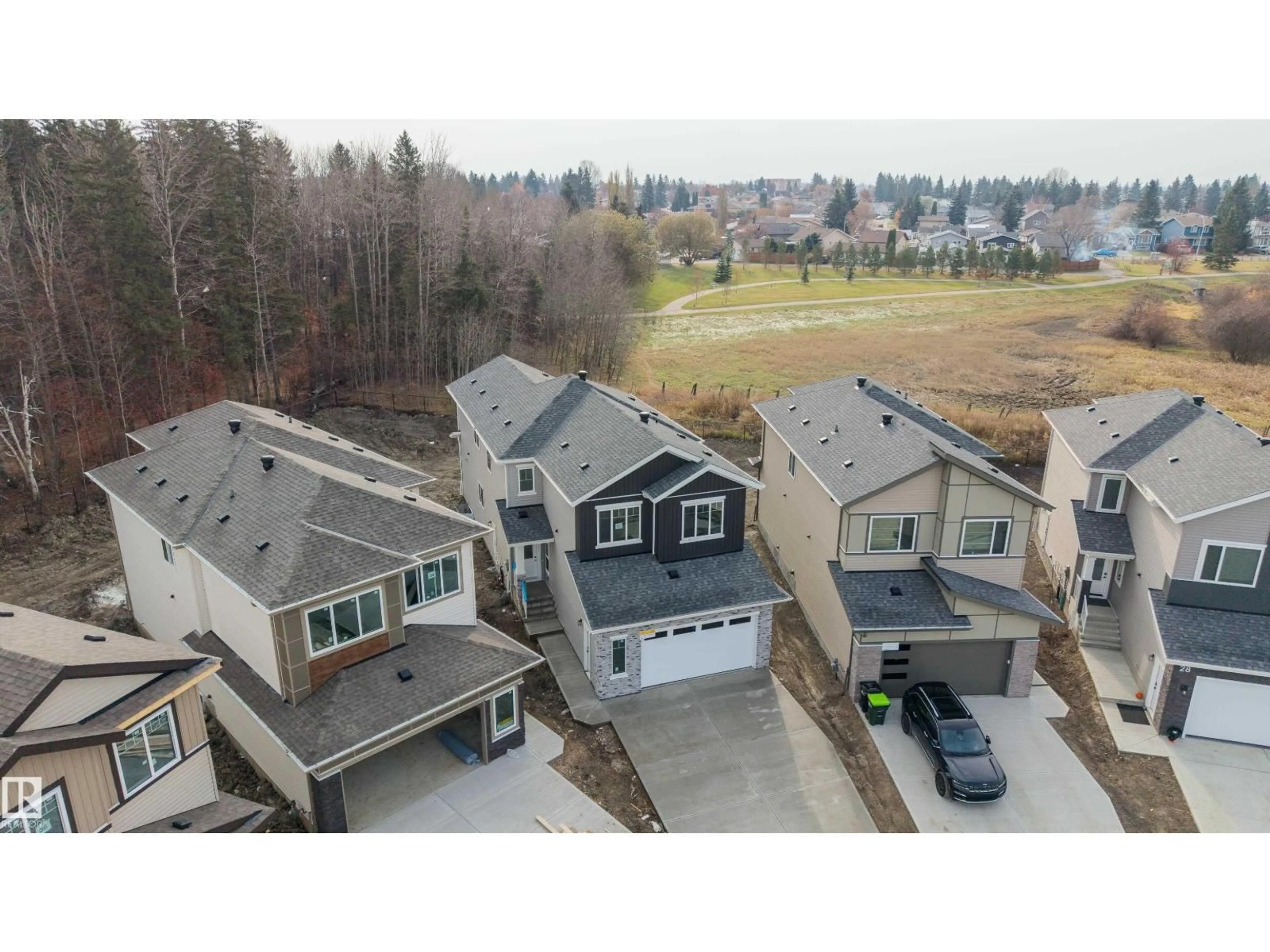 A pic from outside/outdoor area/front of a property/back of a property/a pic from drone, mountain view for 32 MEADOWGROVE LD, Spruce Grove Alberta T7X0W2