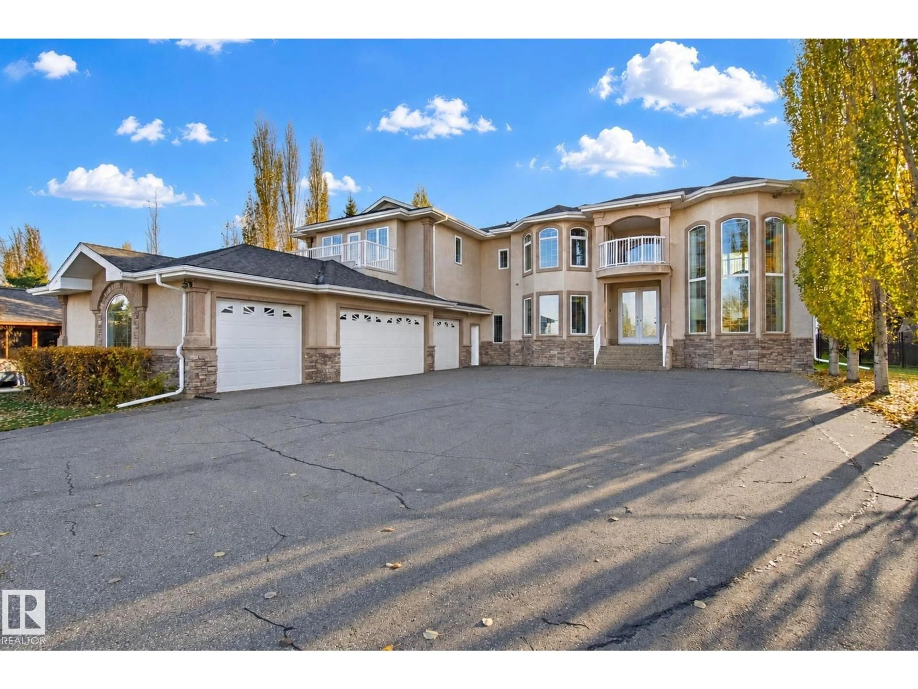 A pic from outside/outdoor area/front of a property/back of a property/a pic from drone, street for 16 - 26126 HGHWAY 16, Rural Parkland County Alberta T7Y1A1