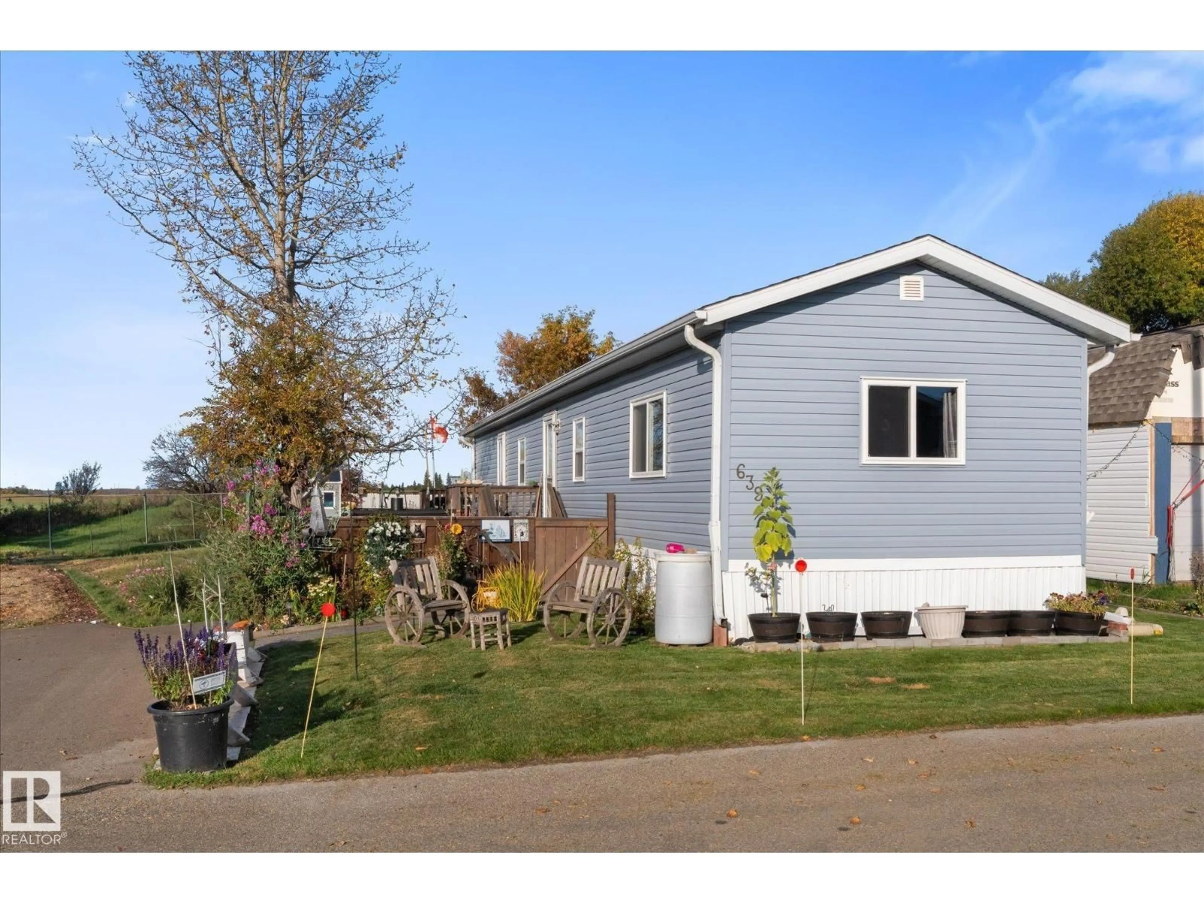 Home with vinyl exterior material, street for 639 53222 RGE RD 272, Rural Parkland County Alberta T7X3P7