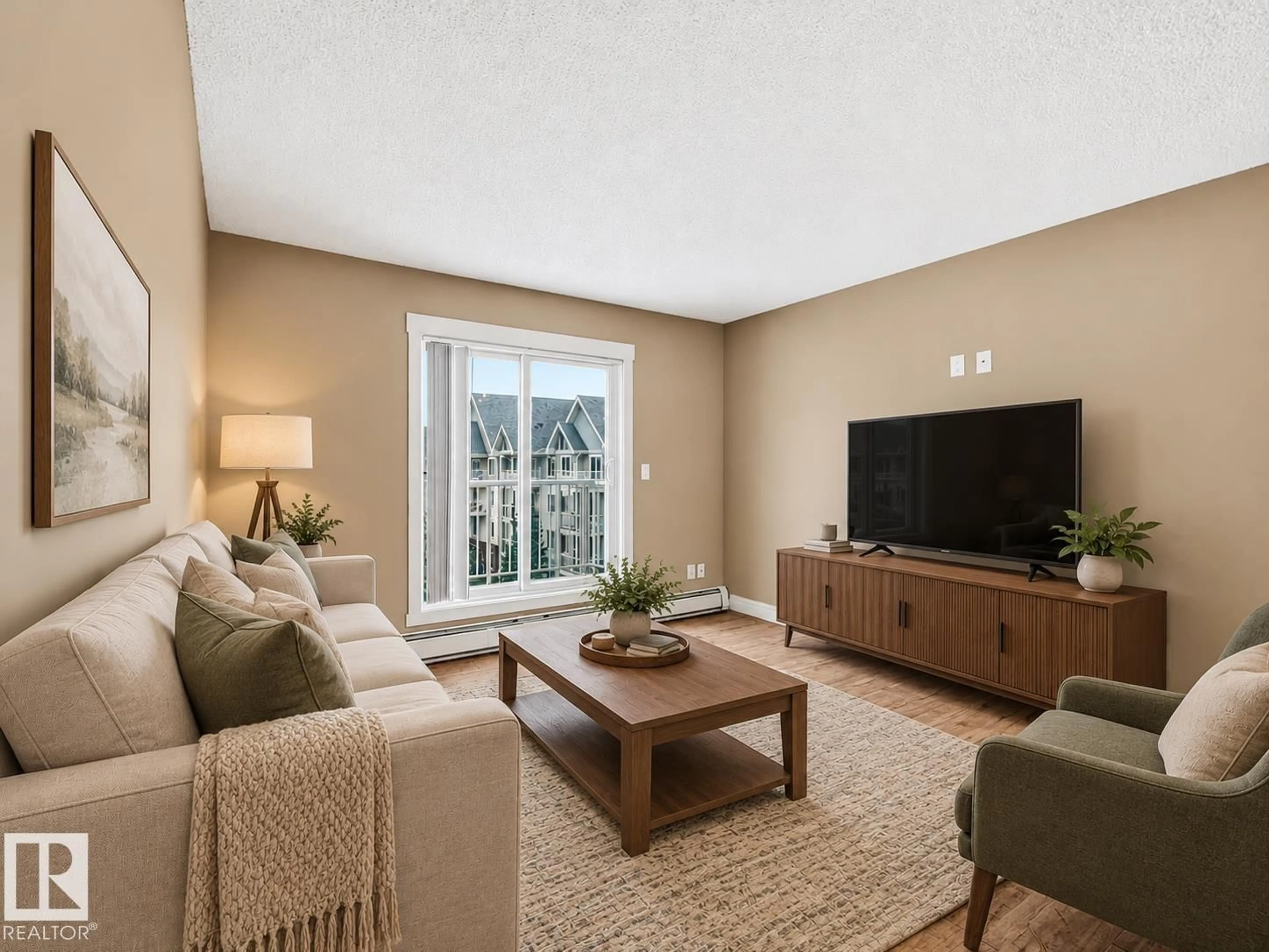Living room with furniture, unknown for #406 - 13830 150 AV, Edmonton Alberta T6V1X2