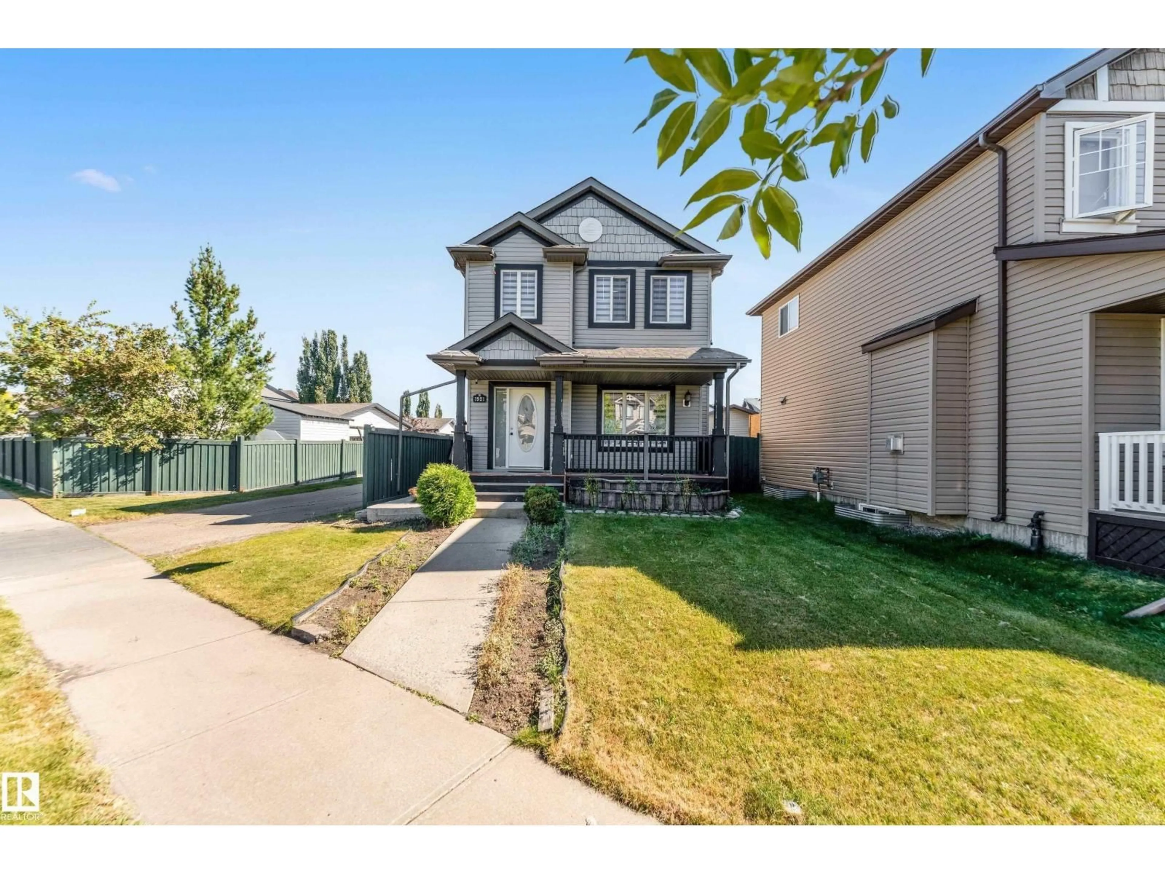 Home with vinyl exterior material, street for SW - 1921 119A ST, Edmonton Alberta T6W0E2