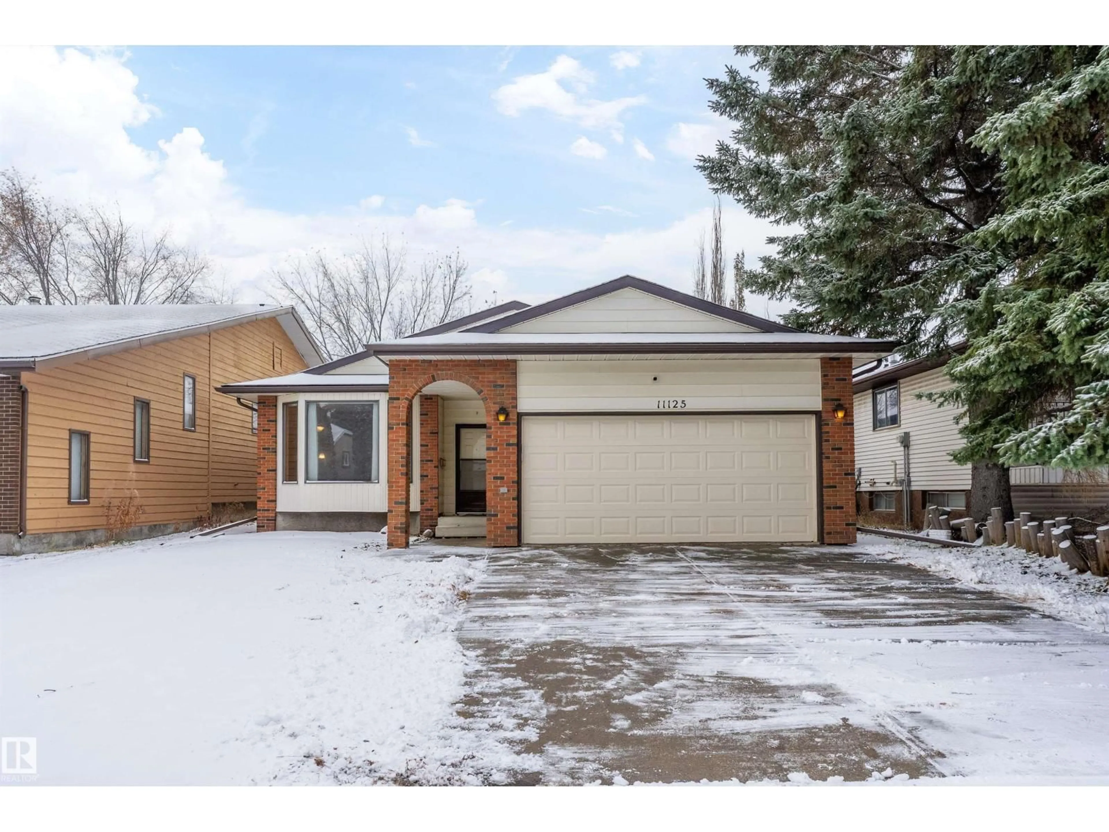 Home with brick exterior material, street for 11125 19 AV, Edmonton Alberta T6J4Z5
