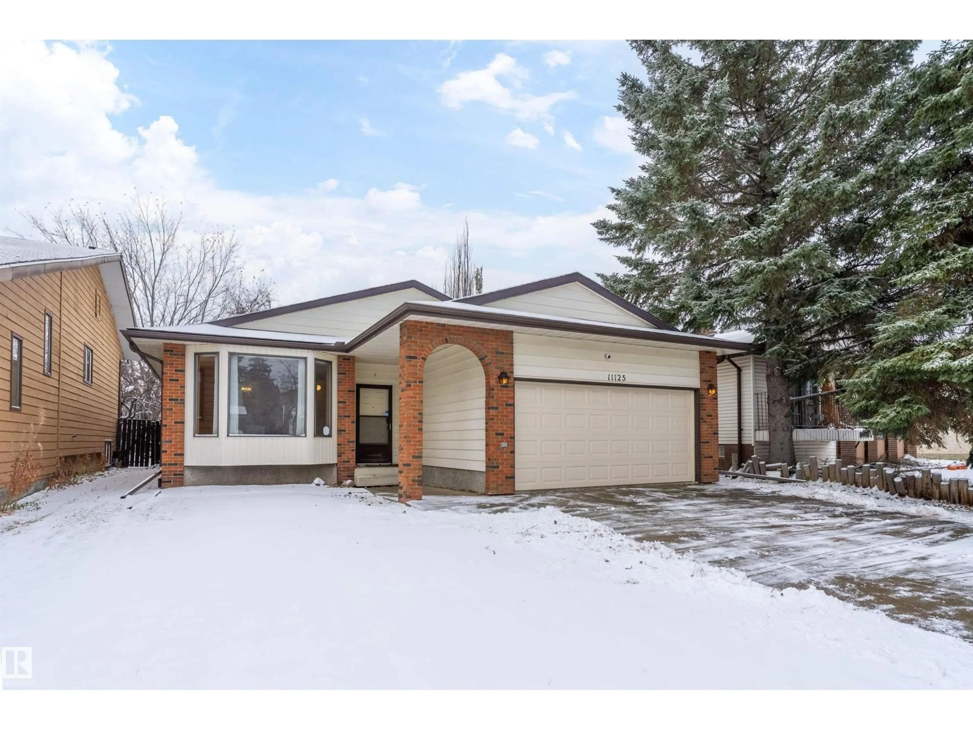 Home with brick exterior material, street for 11125 19 AV, Edmonton Alberta T6J4Z5