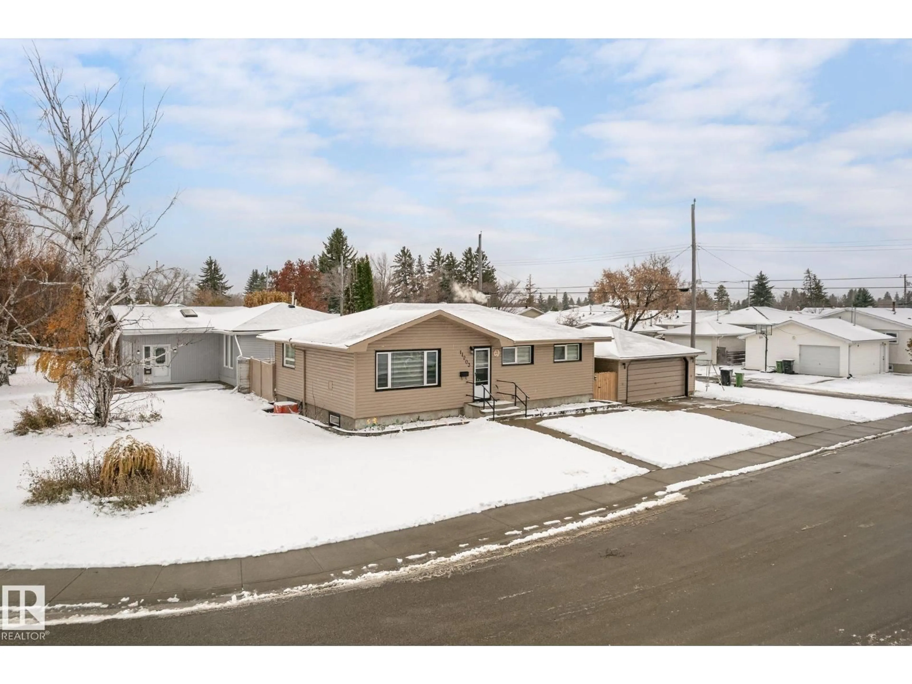 A pic from outside/outdoor area/front of a property/back of a property/a pic from drone, street for 11203 136 AV, Edmonton Alberta T5E1W9
