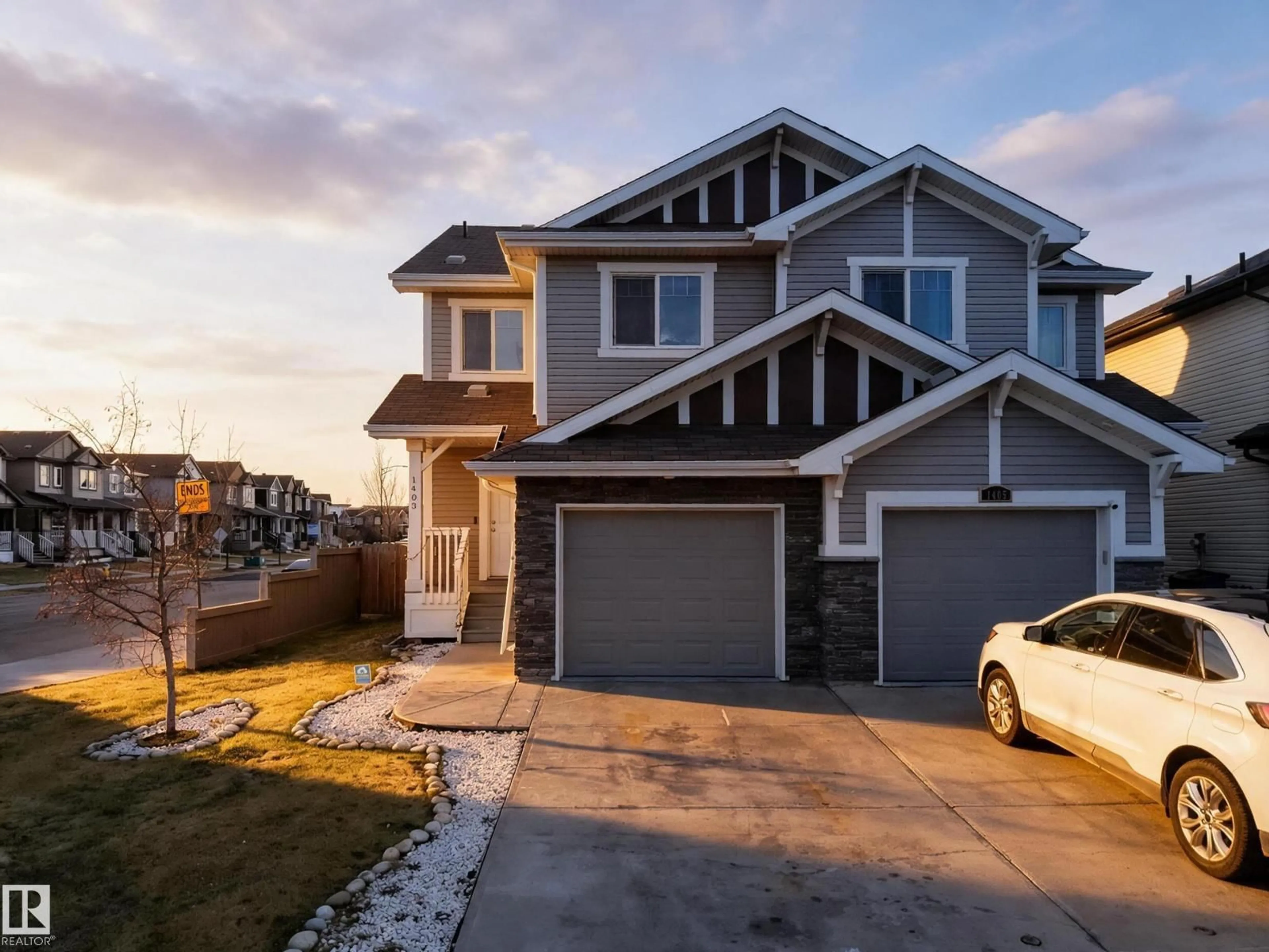Home with vinyl exterior material, street for NW - 1403 26 AVE, Edmonton Alberta T6T0W1