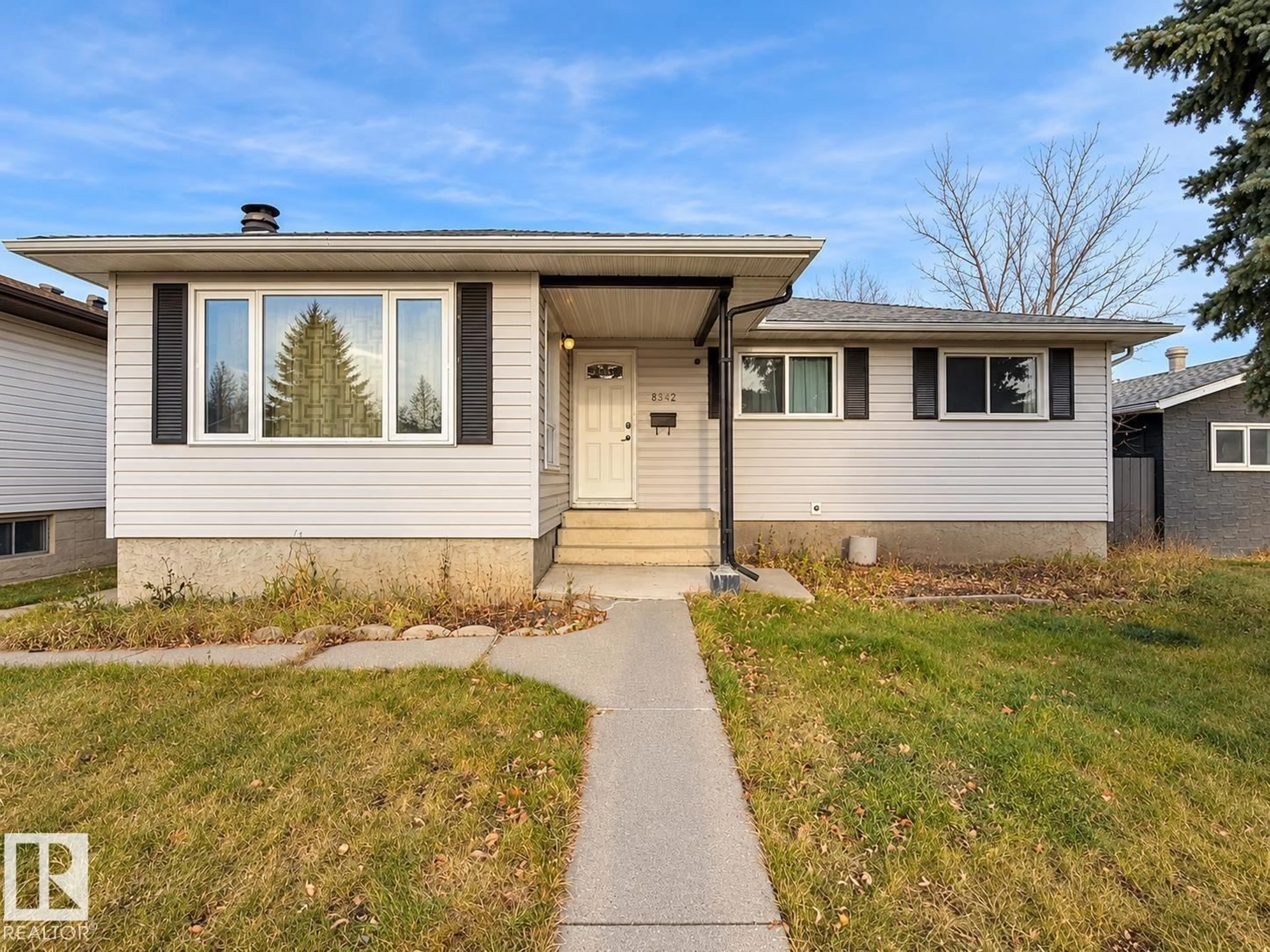 Home with vinyl exterior material, street for 8412 35 AV, Edmonton Alberta T6K0C6