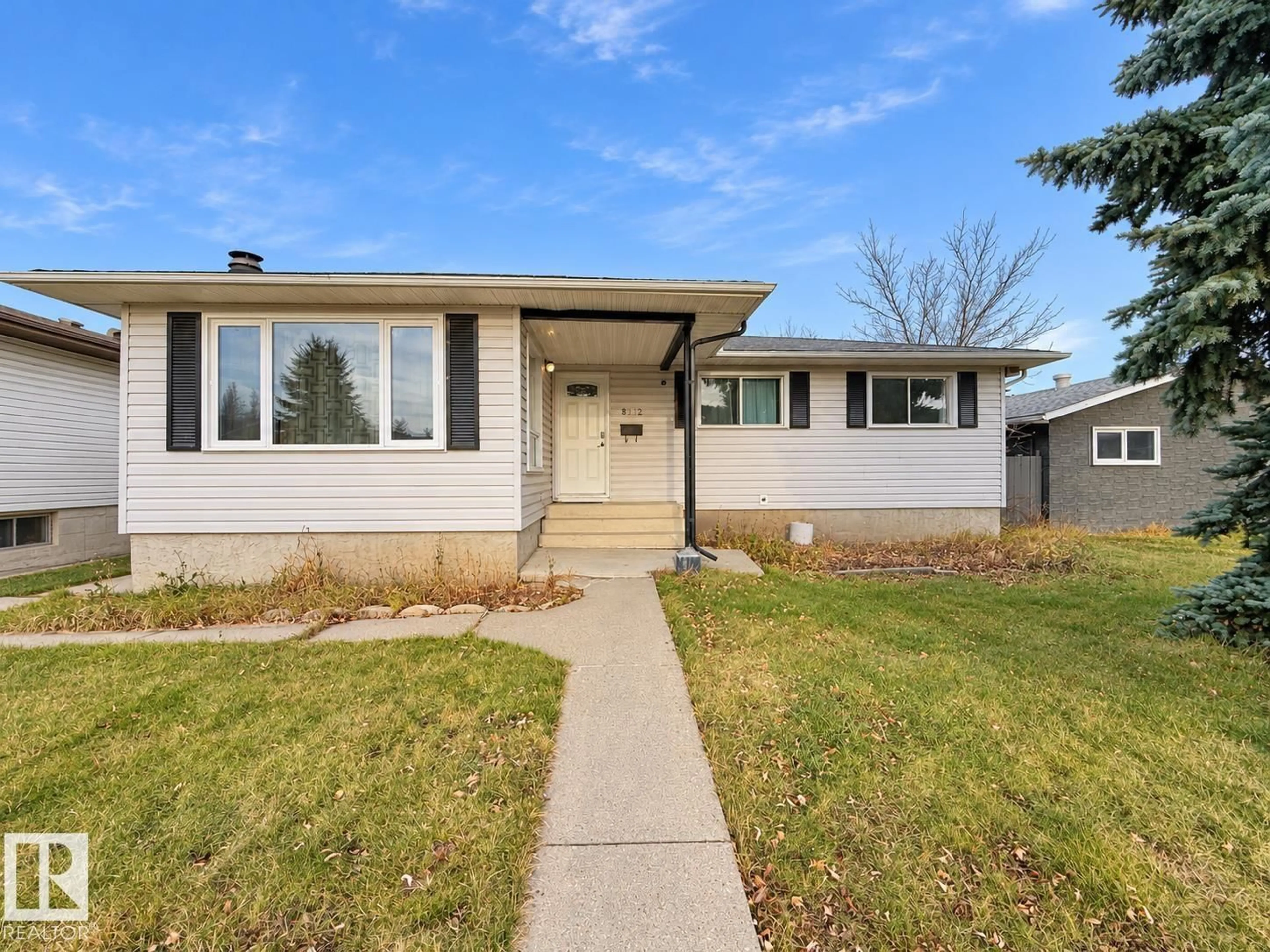 Home with vinyl exterior material, street for 8412 35 AV, Edmonton Alberta T6K0C6