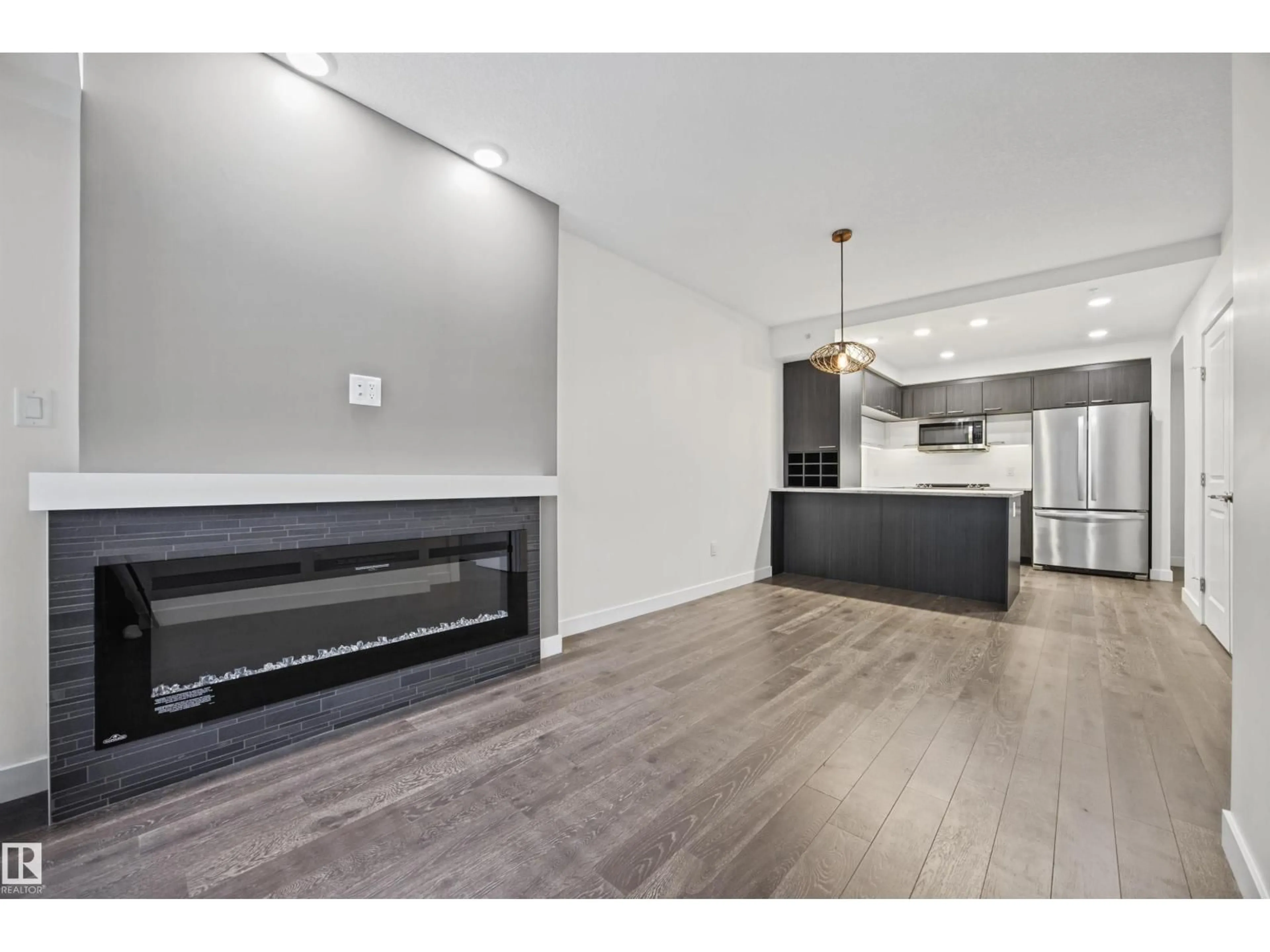 Open concept kitchen, wood/laminate floor for #802 - 9720 106 ST, Edmonton Alberta T5K0K8