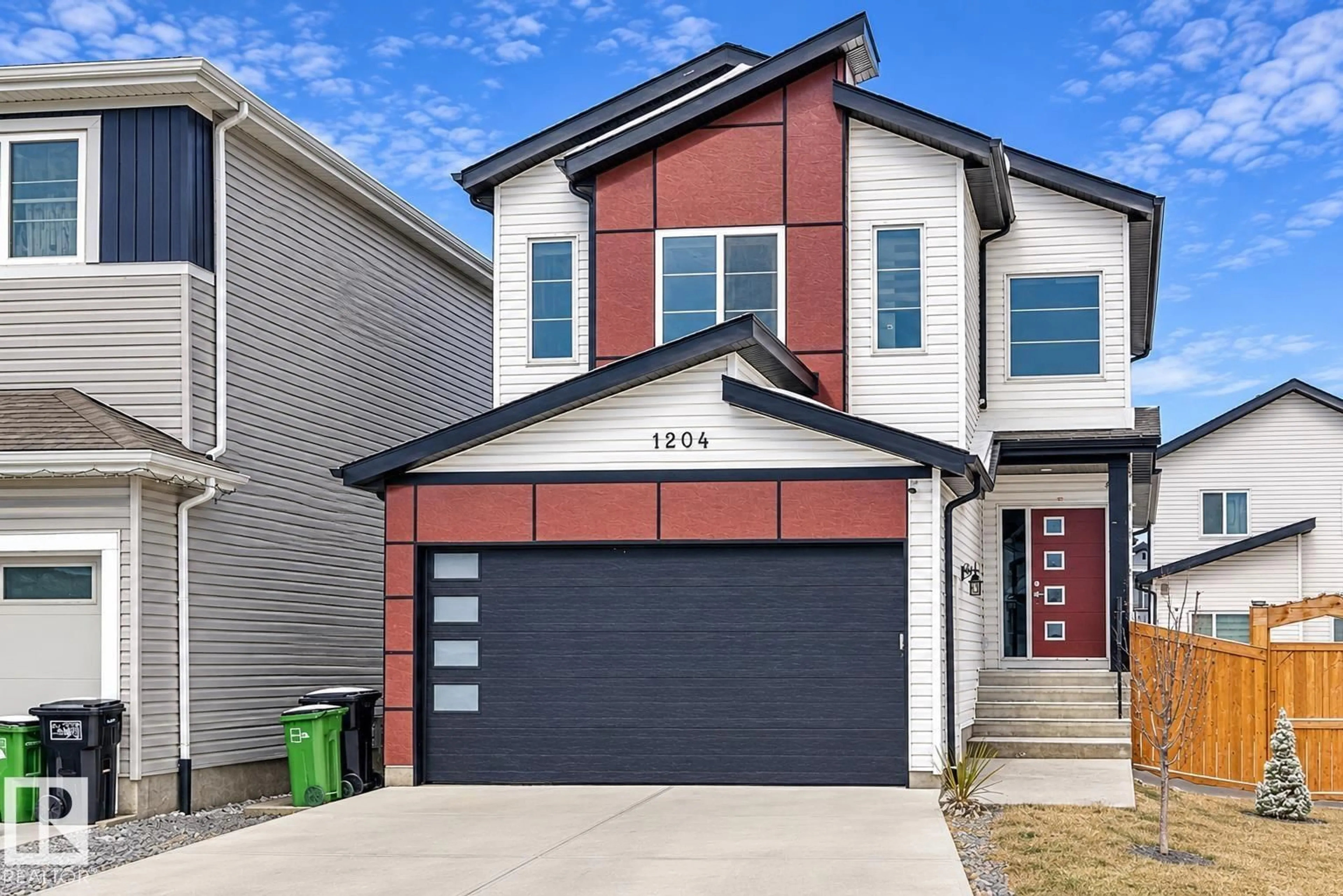 Home with vinyl exterior material, street for 1204 13 AV, Edmonton Alberta T6T2W2