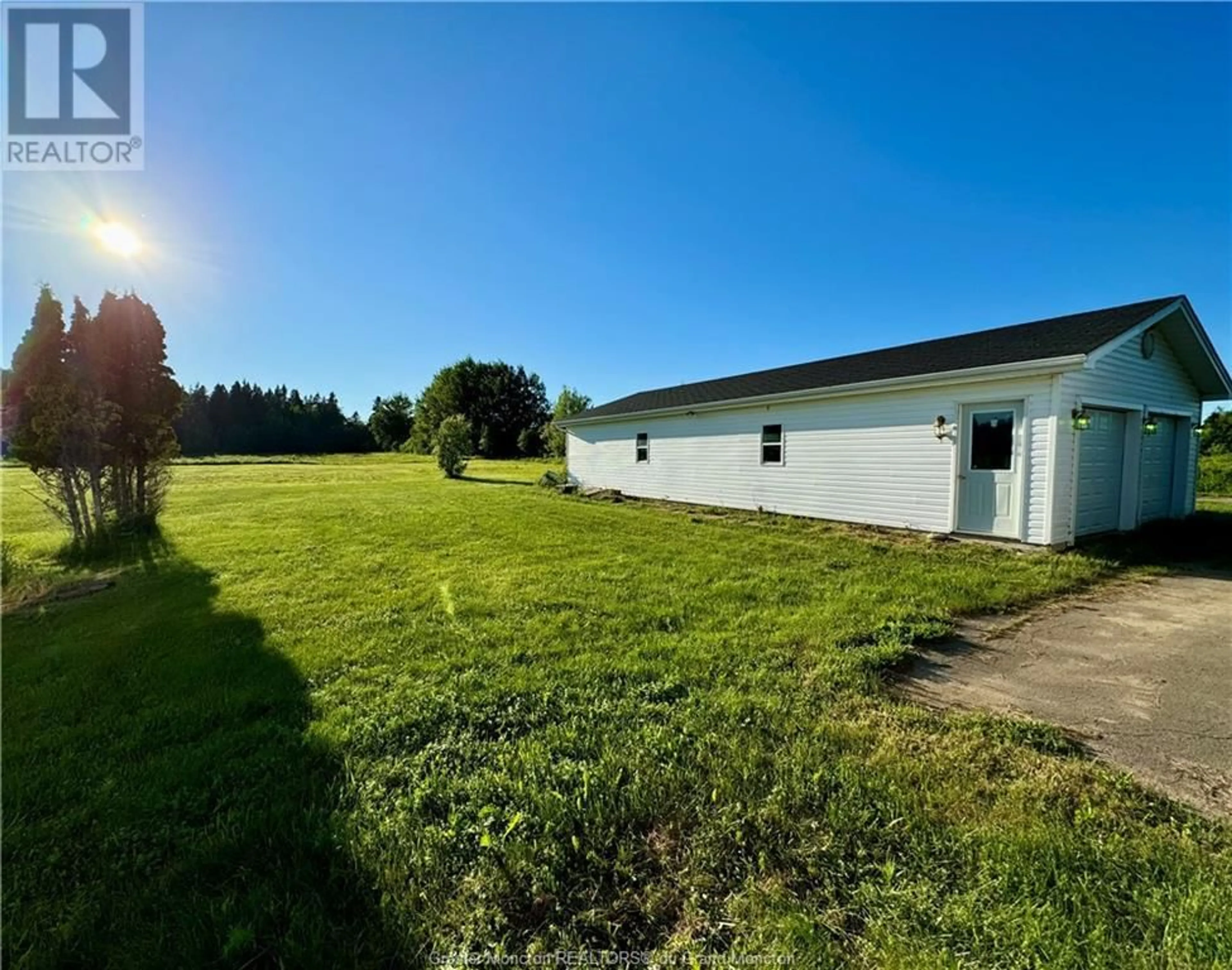 Frontside or backside of a home, the fenced backyard for 309 Route 530, Grande-Digue New Brunswick E4R5C7