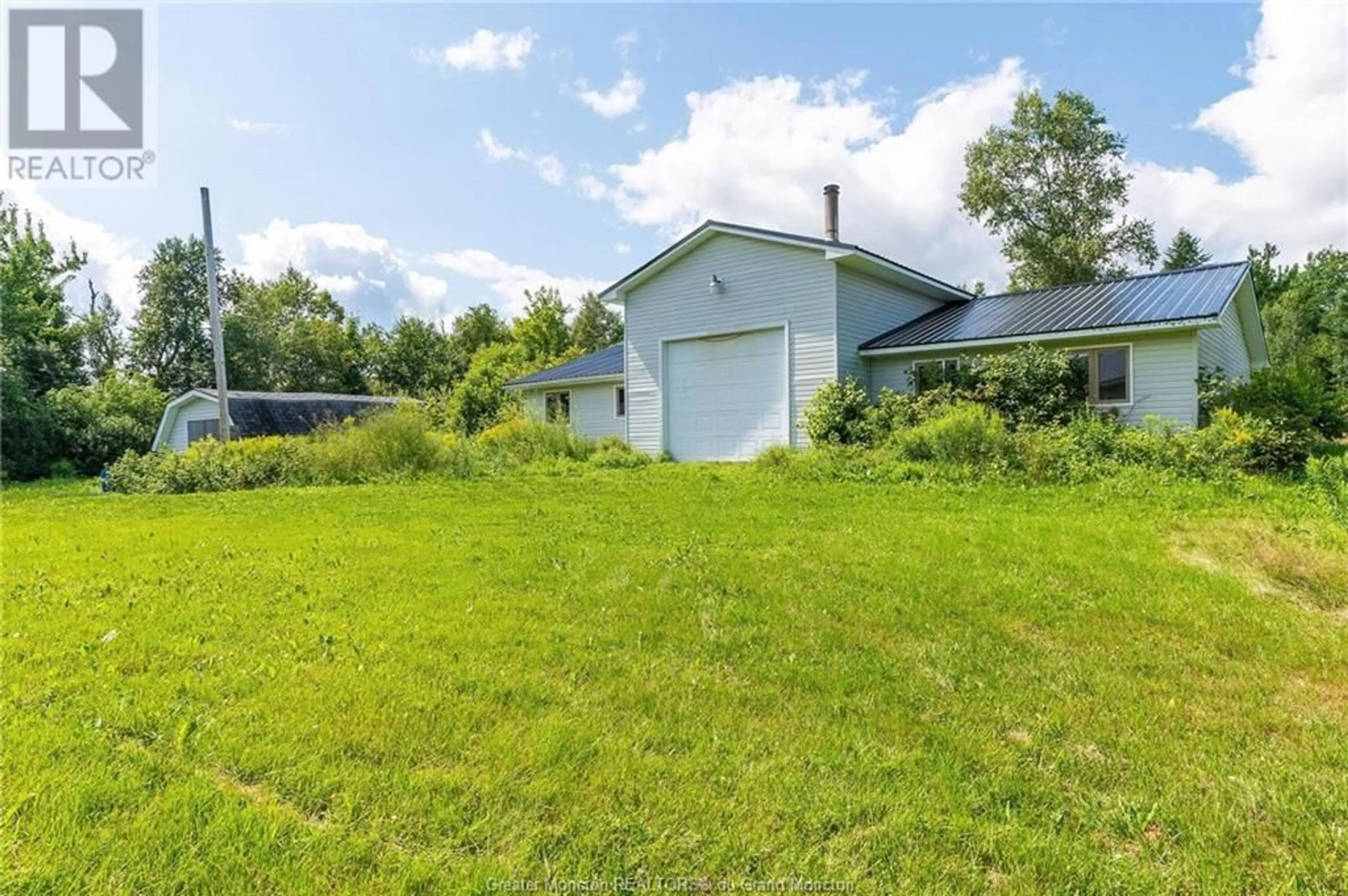 Frontside or backside of a home, the fenced backyard for 6912 Rte 515 Route, Saint-Paul New Brunswick E4T3R1