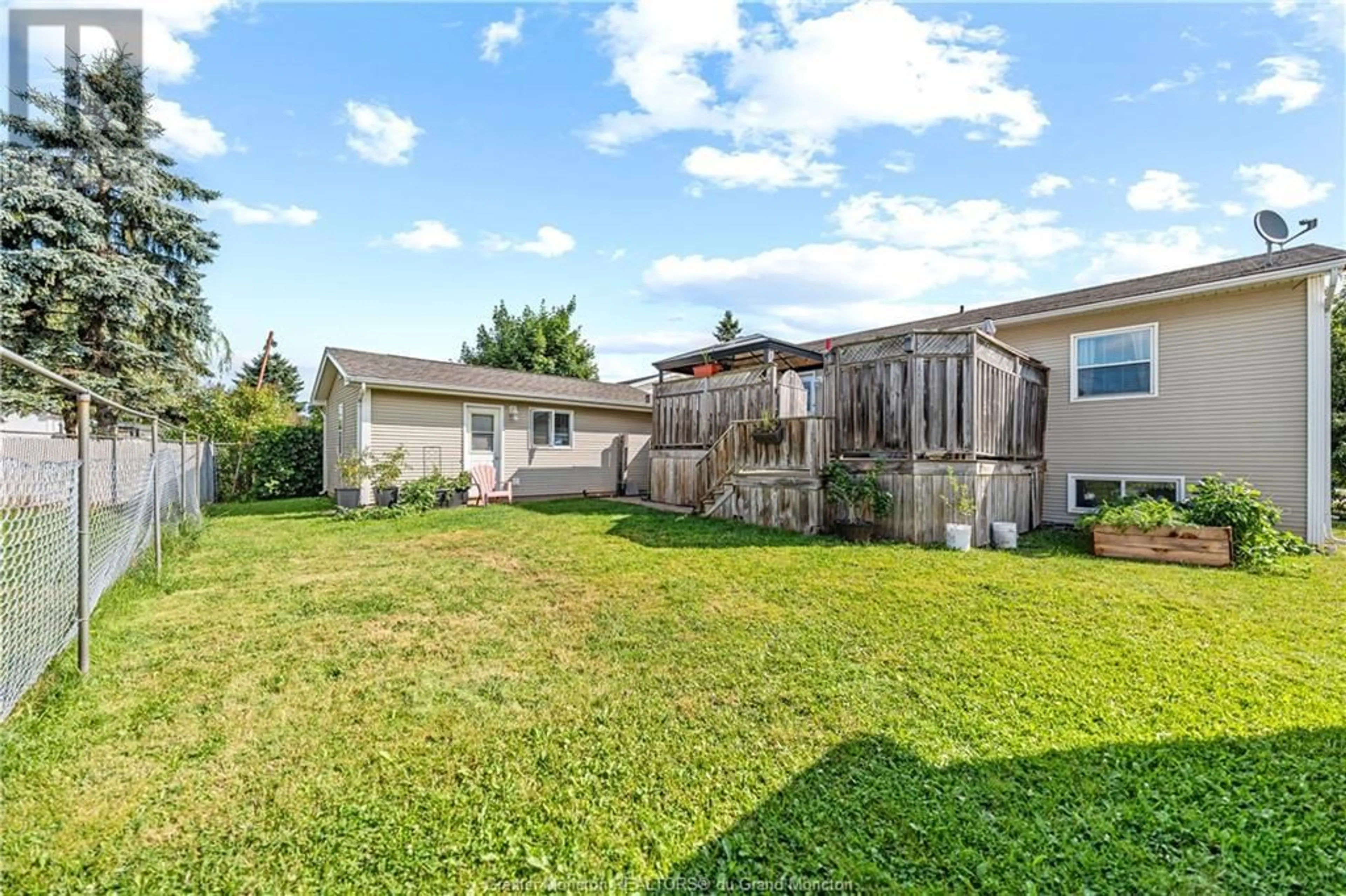 Frontside or backside of a home, the fenced backyard for 54 Castle Drive, Moncton New Brunswick E1A6M1