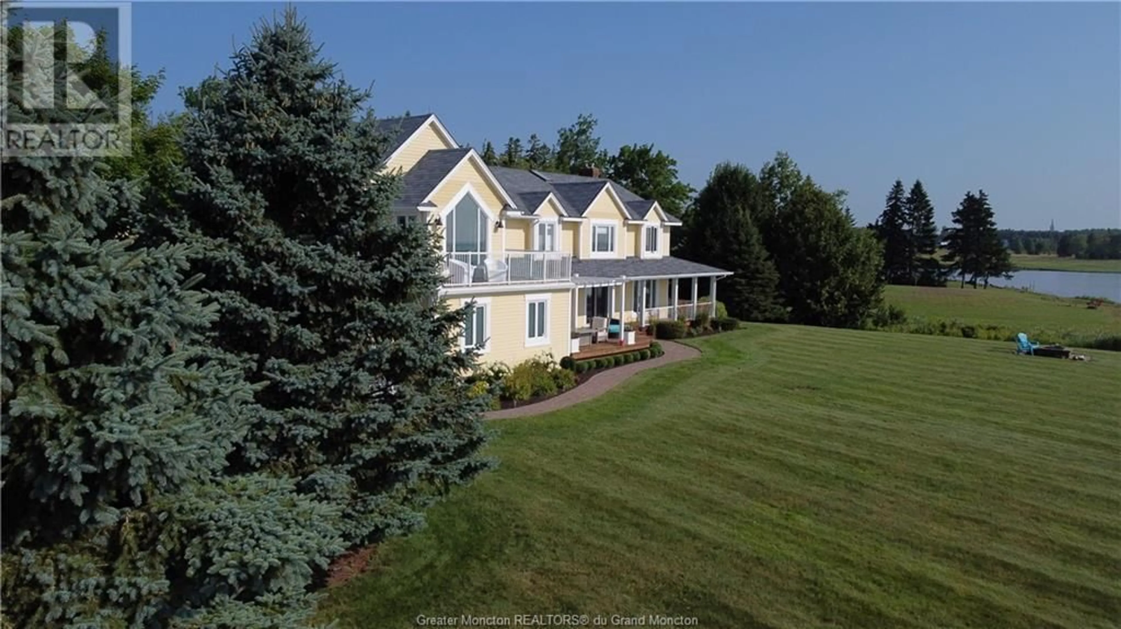 A pic from exterior of the house or condo, the fenced backyard for 83 Martin Road, Grande-Digue New Brunswick E4R4V4