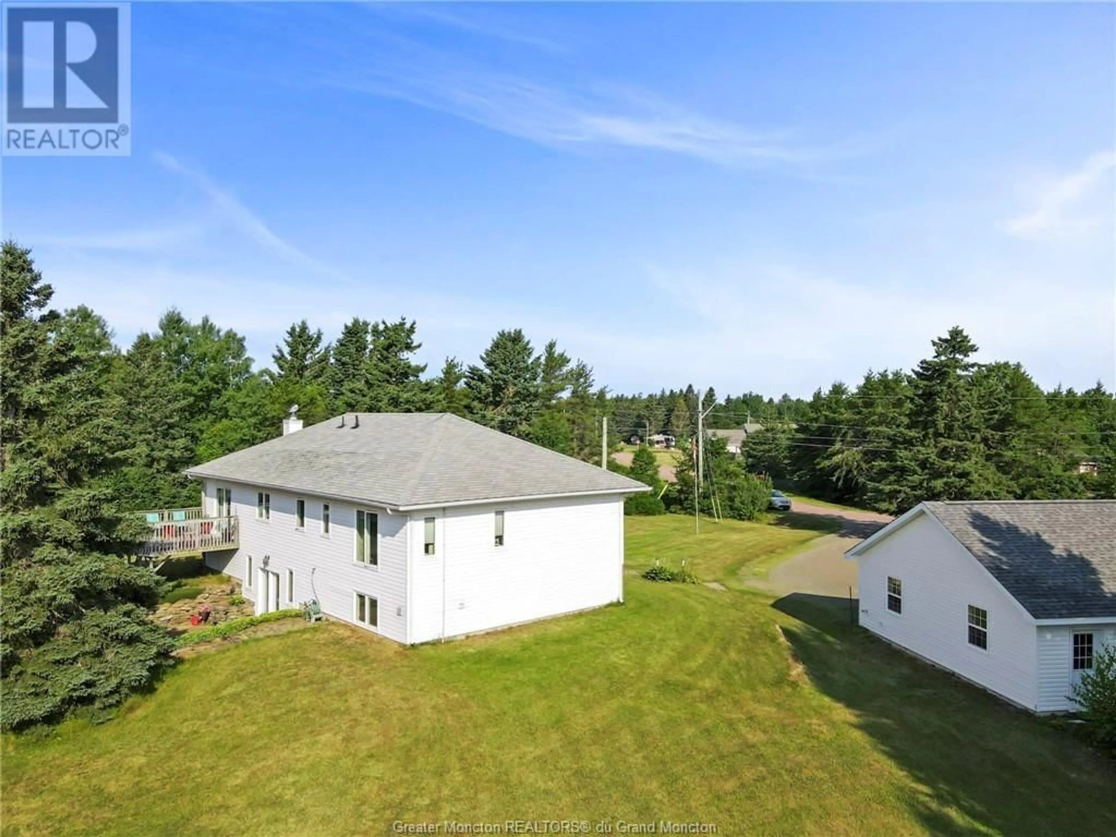 Frontside or backside of a home, the fenced backyard for 21 des Perdrix, Grand-Barachois New Brunswick E4P7H6