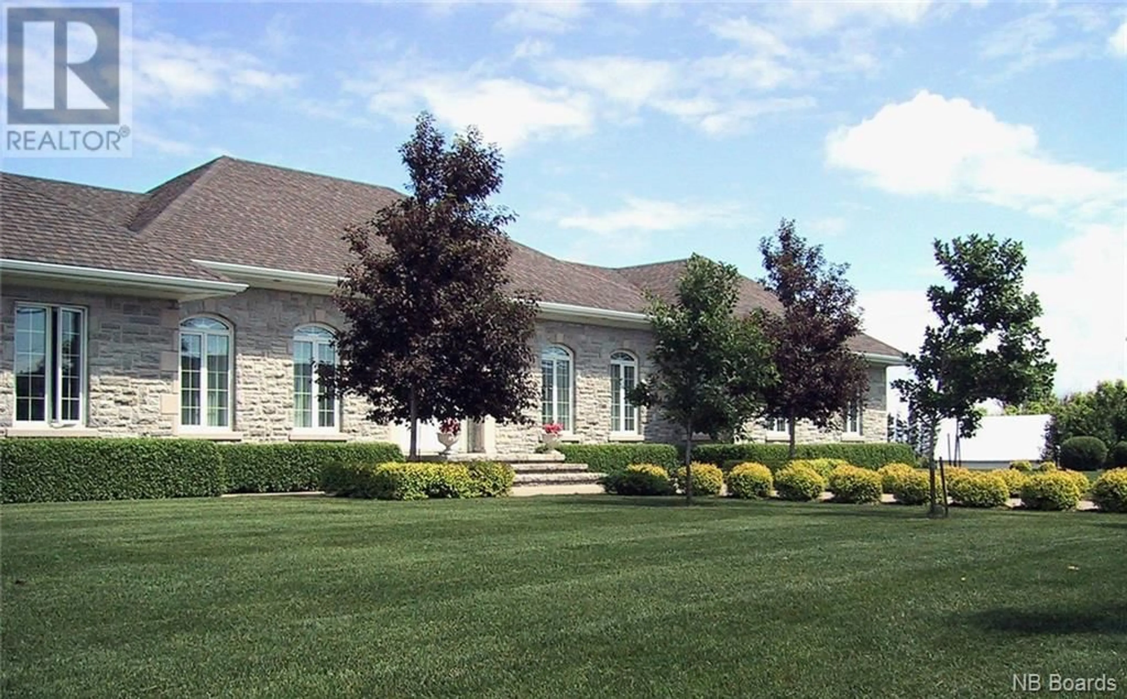 Frontside or backside of a home, the front or back of building for 115 St-Pierre Est Boulevard, Caraquet New Brunswick E1W1A9