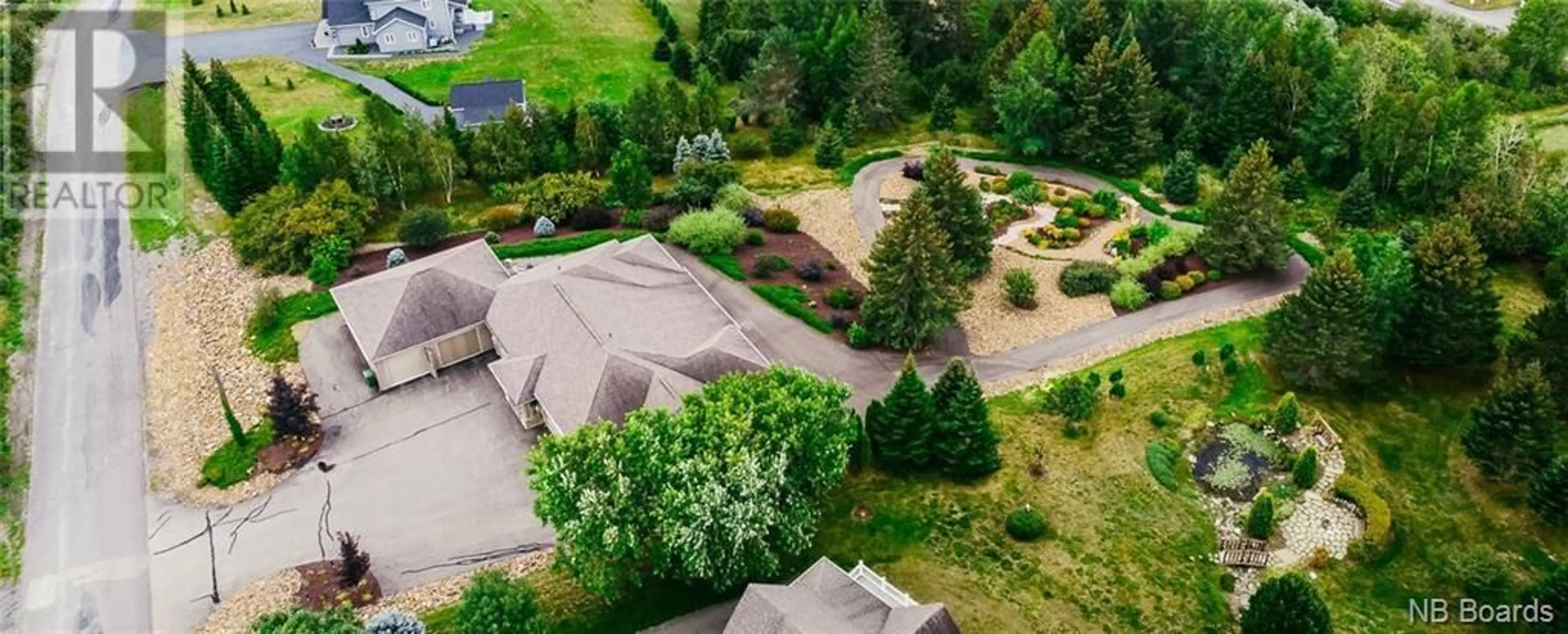 Frontside or backside of a home, the fenced backyard for 22 Du Boisé, Saint-Basile New Brunswick E7C3C6