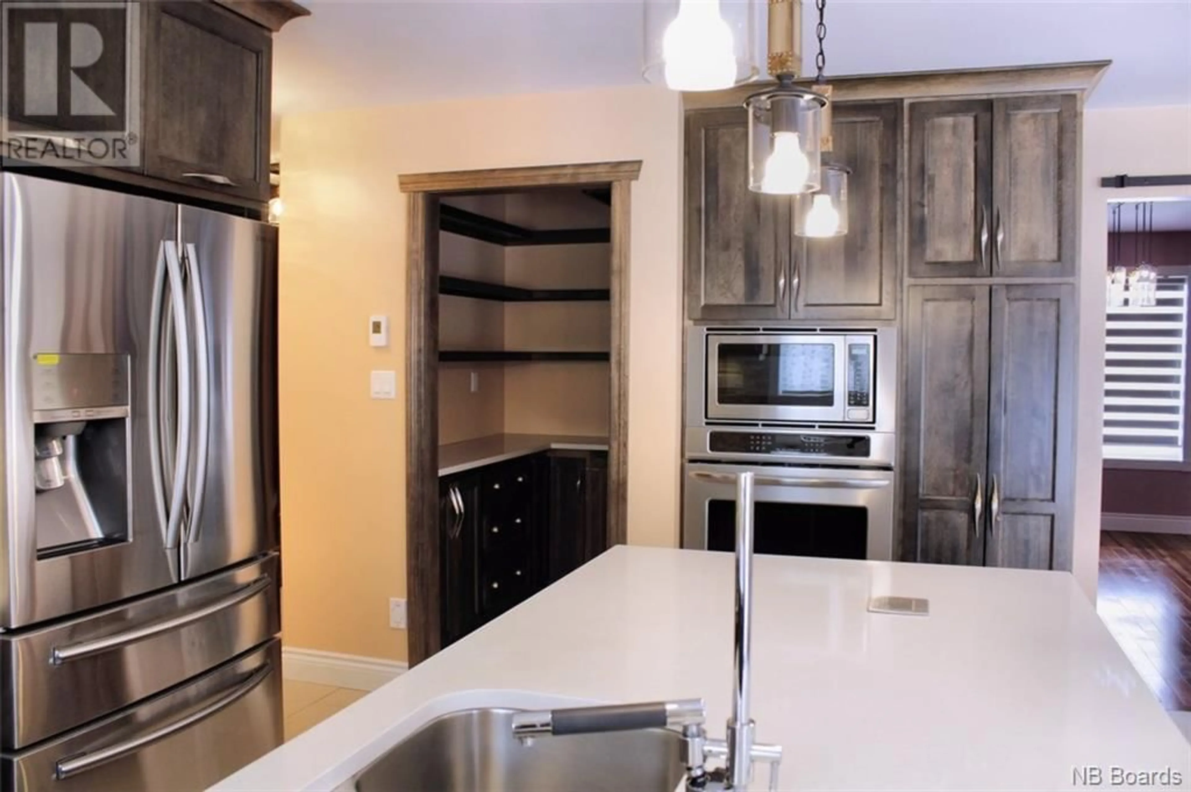 Contemporary kitchen, wood floors for 74 MGR Lacroix Avenue, Edmundston New Brunswick E3V4X9