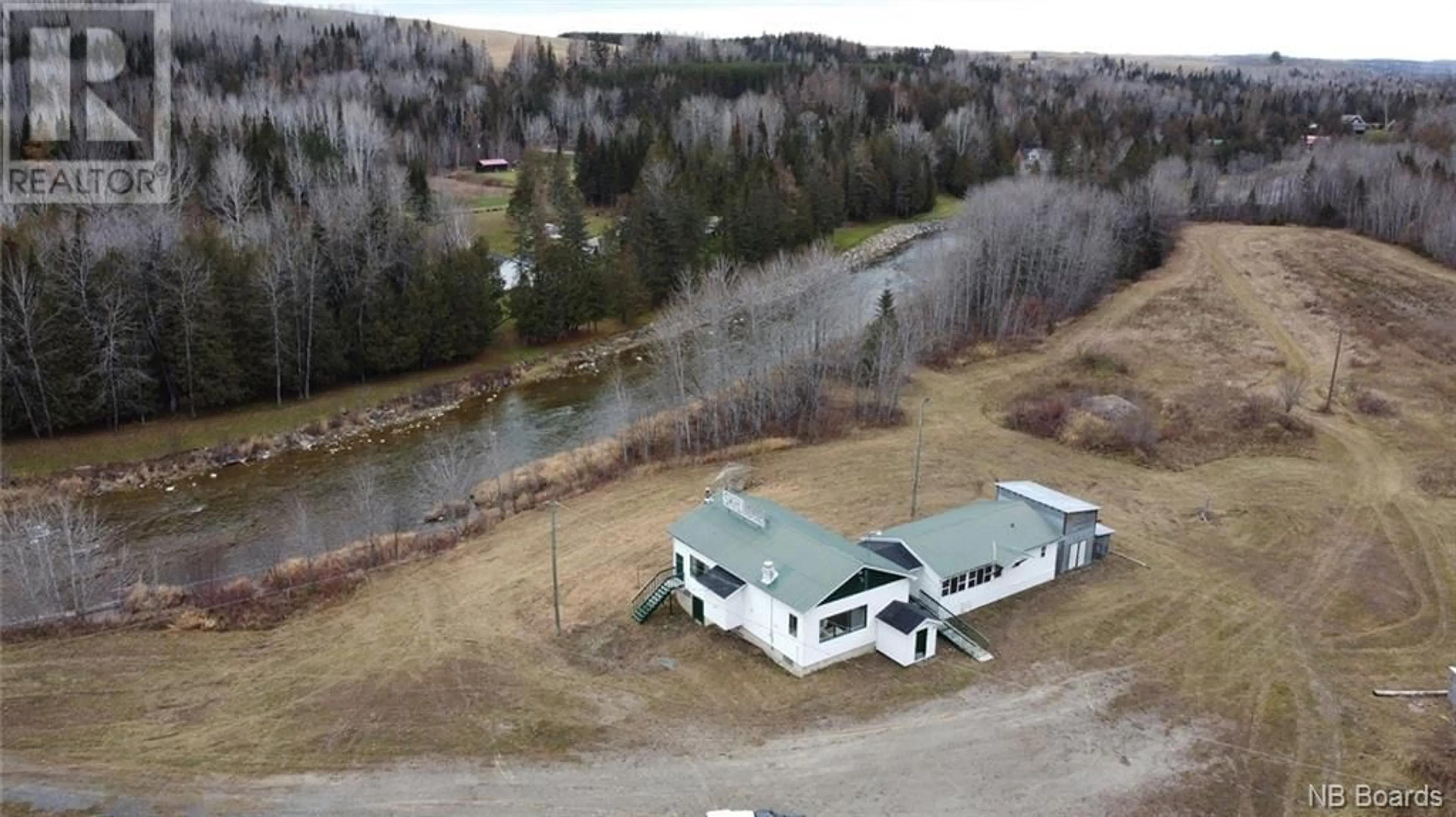 A pic from outside/outdoor area/front of a property/back of a property/a pic from drone, water/lake/river/ocean view for 118 MILL HILL ROAD, New Denmark New Brunswick E7G2J4