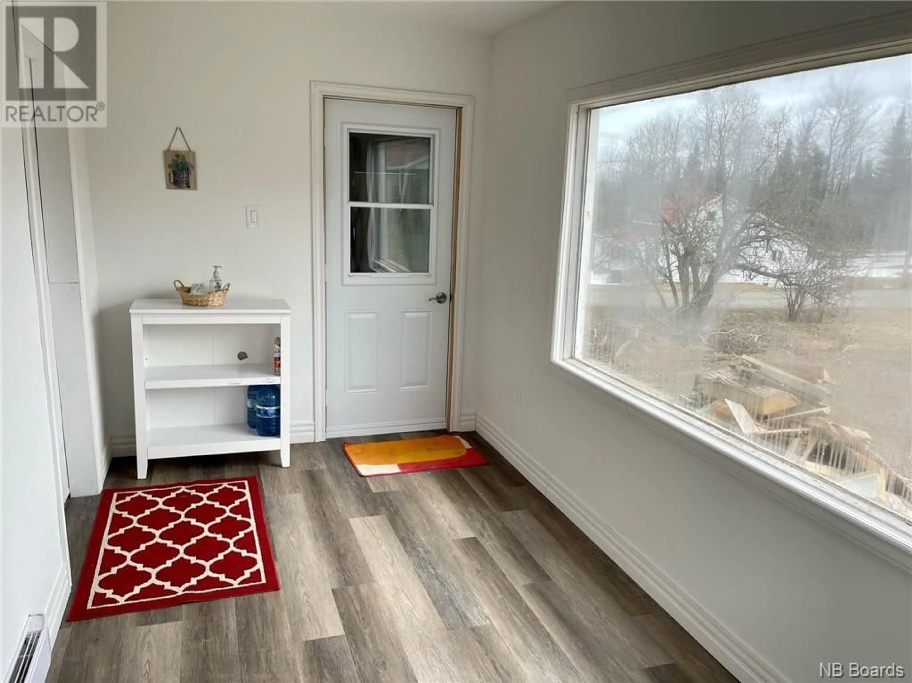 A pic of a room, wood floors for 140 Main Street, Plaster Rock New Brunswick E7G2E4