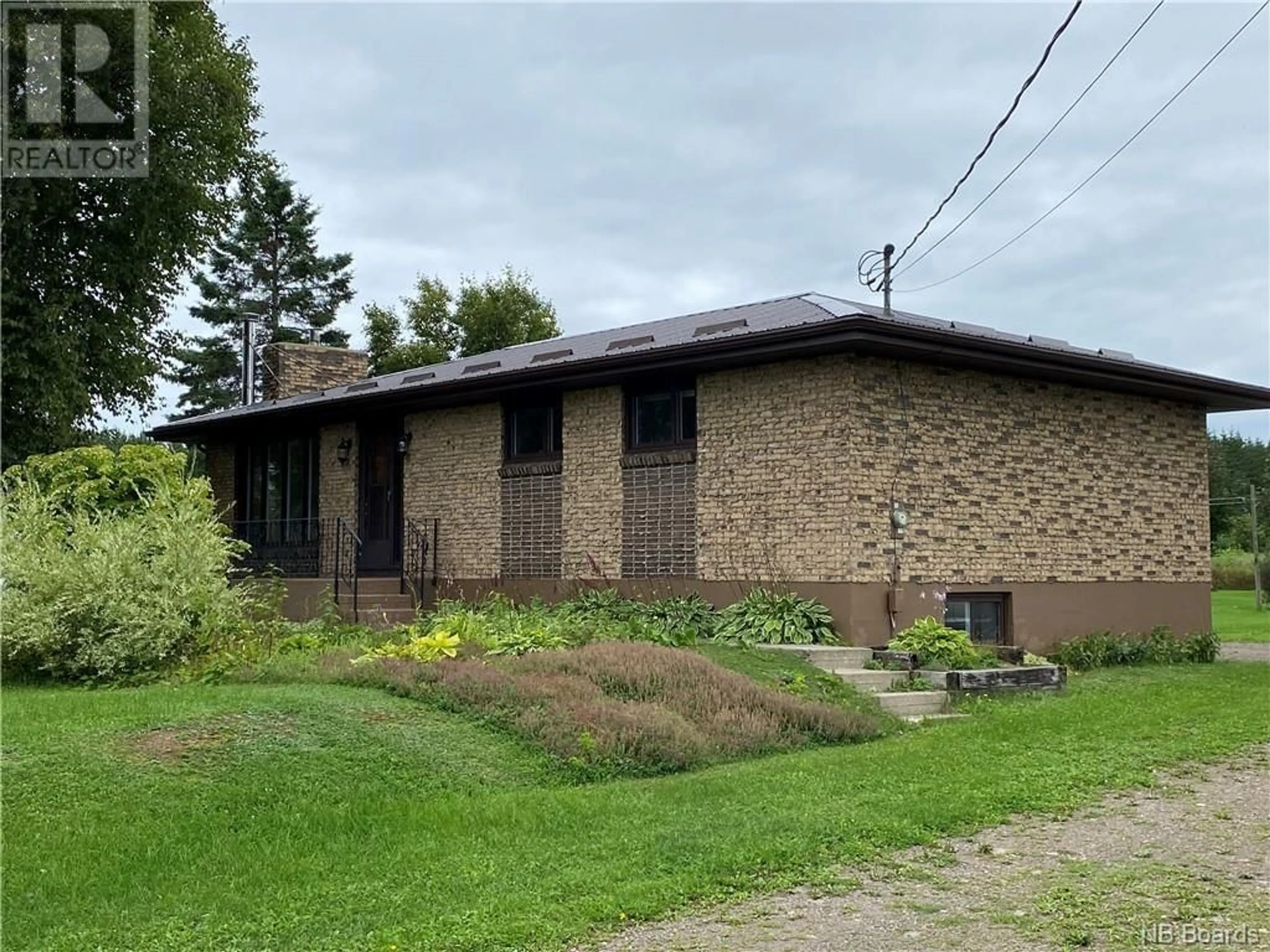 Home with stone exterior material for 188 Rue Principale, Pointe-Verte New Brunswick E8J2W8