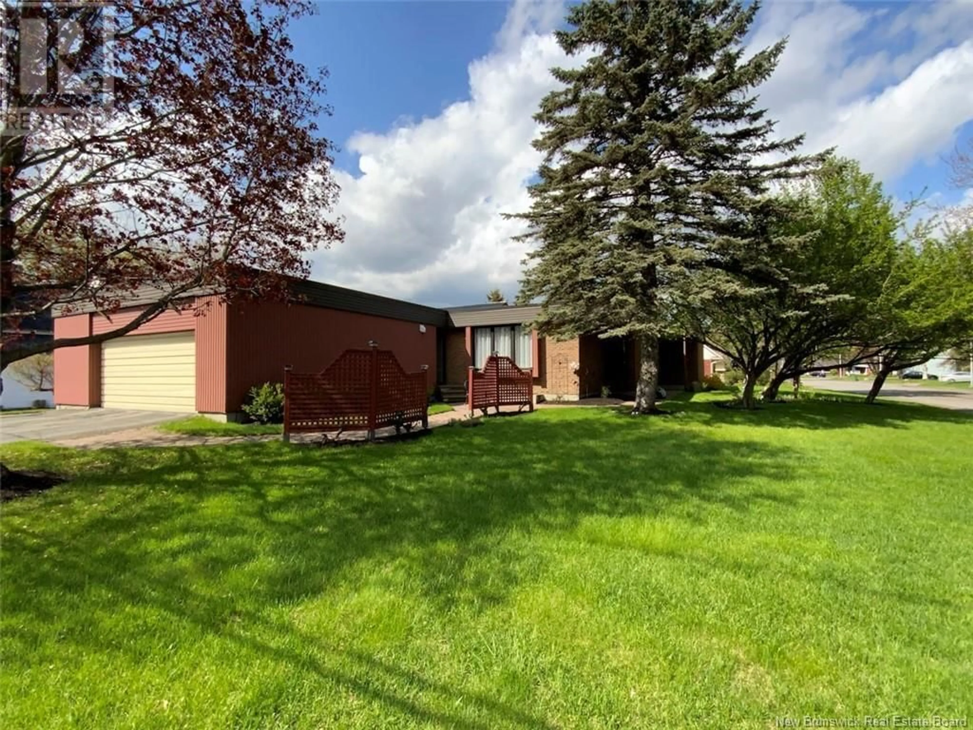 Frontside or backside of a home, the fenced backyard for 60 Ordonnance Avenue, Edmundston New Brunswick E3V1C5