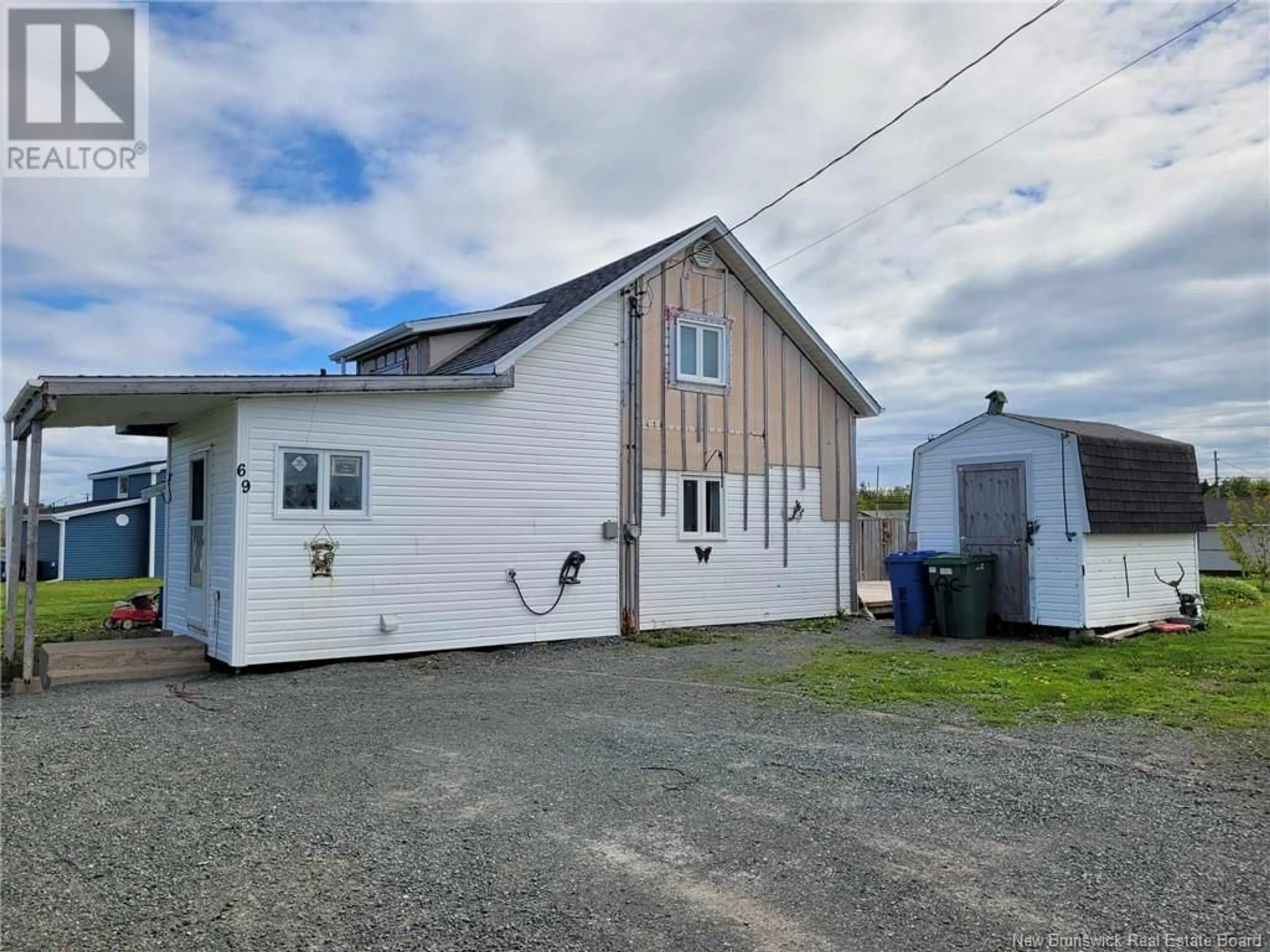 Frontside or backside of a home, the front or back of building for 69 Rue du Parc E, Pointe-Verte New Brunswick E8J2S6