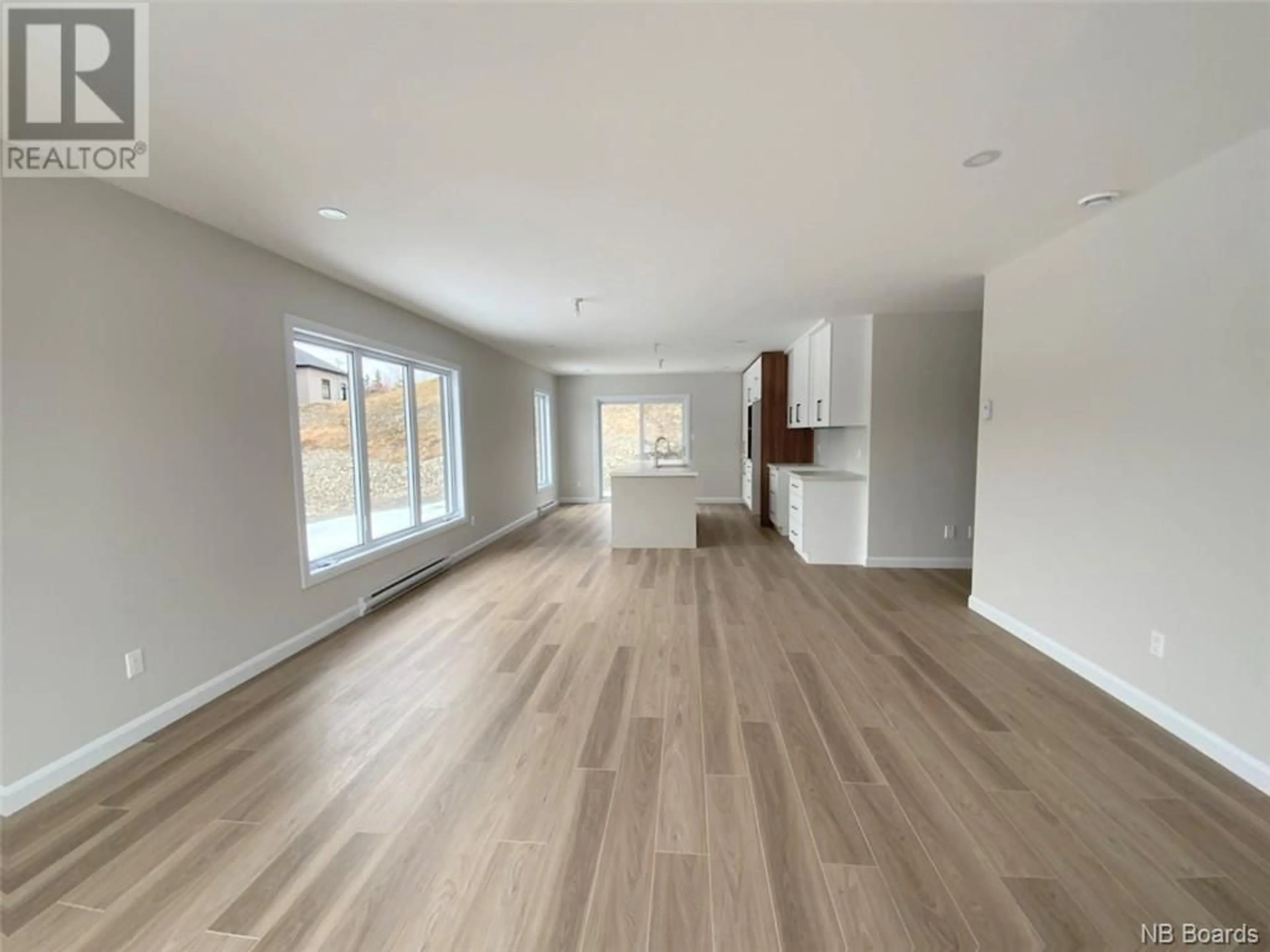 A pic of a room, wood floors for 36 Rue Volpé, Edmundston New Brunswick E3V0H9